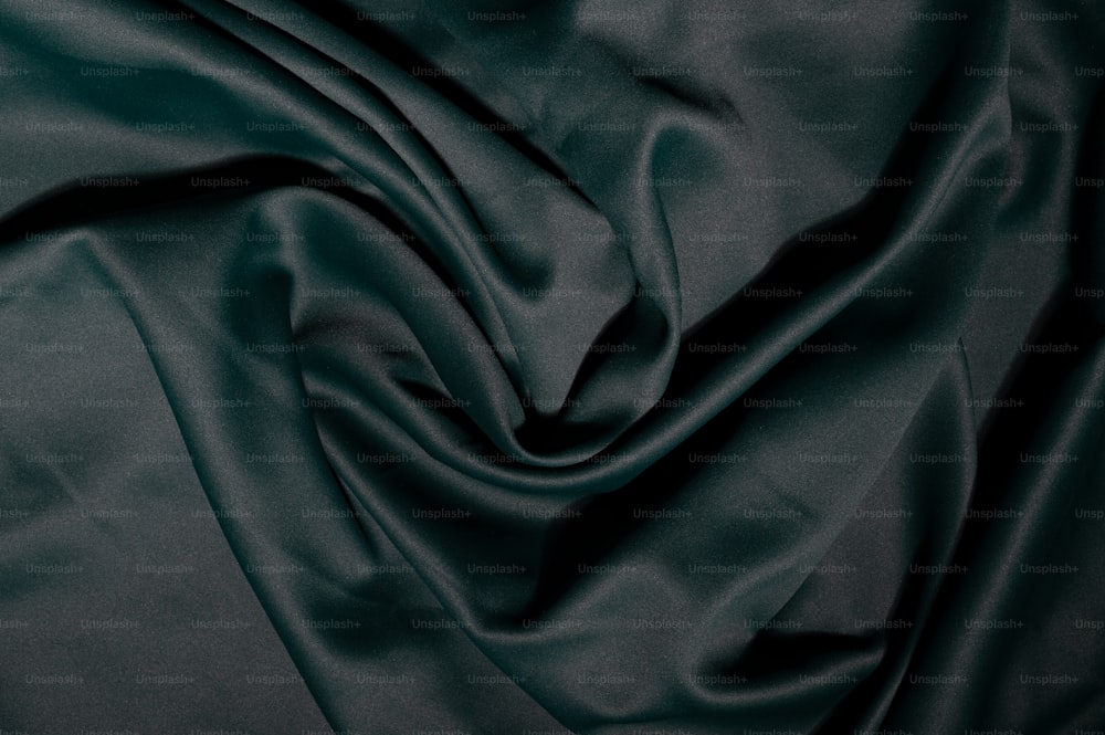 a close up view of a dark green fabric