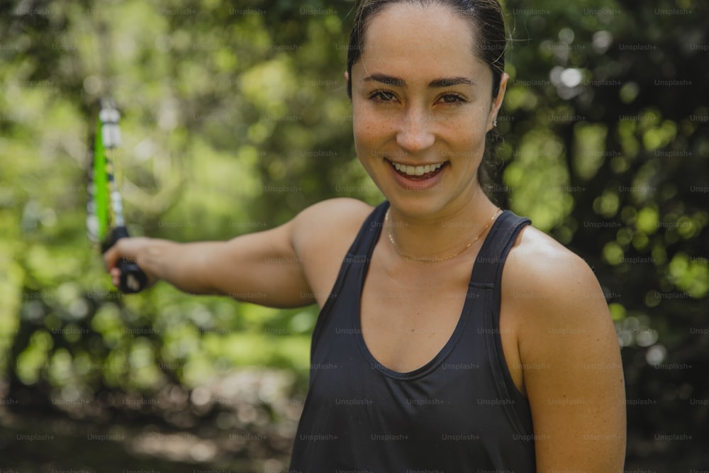 a woman holding a green object in her hand