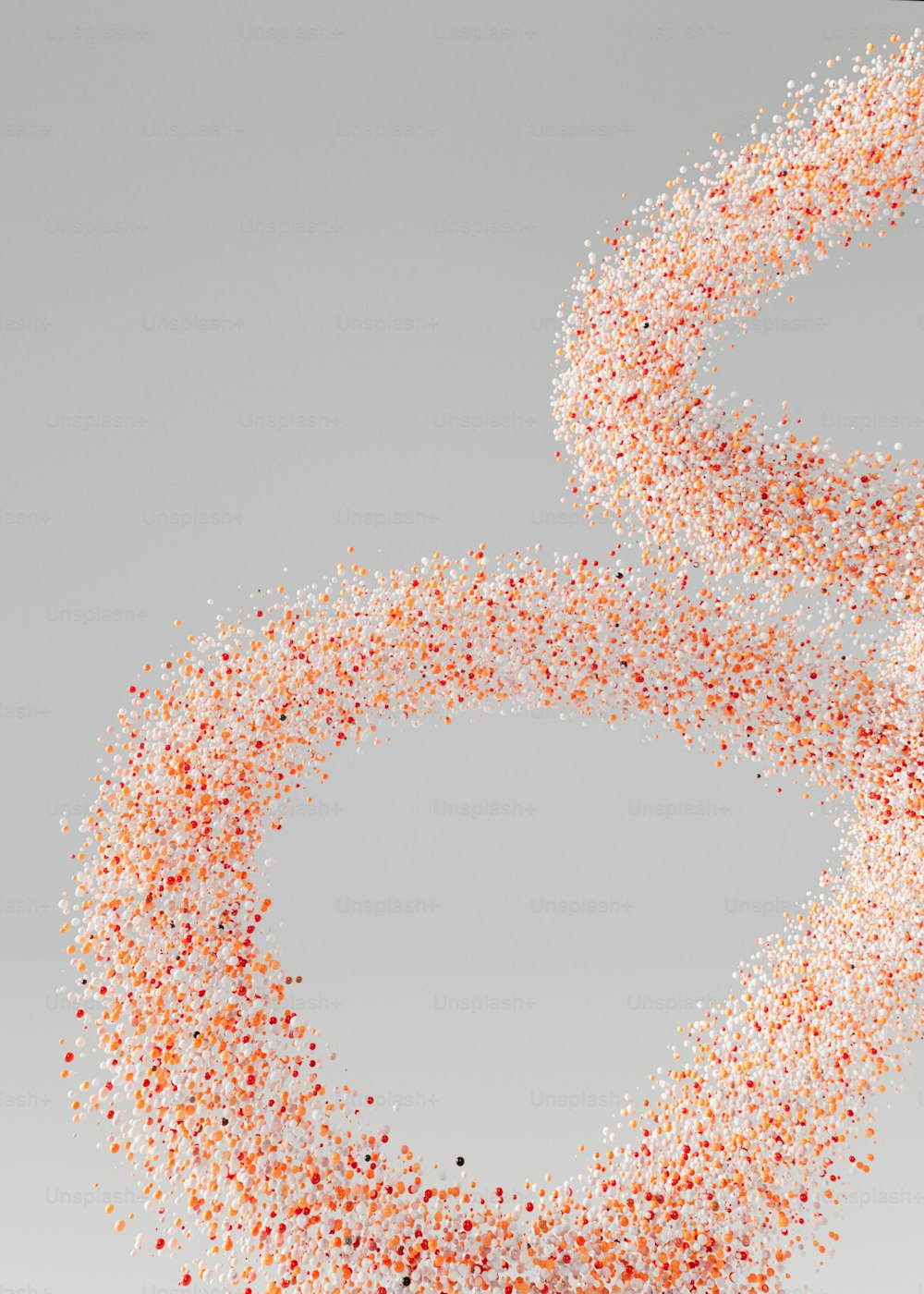 a group of orange and white confetti sprinkles