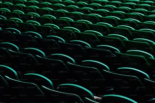 a row of green seats in a stadium