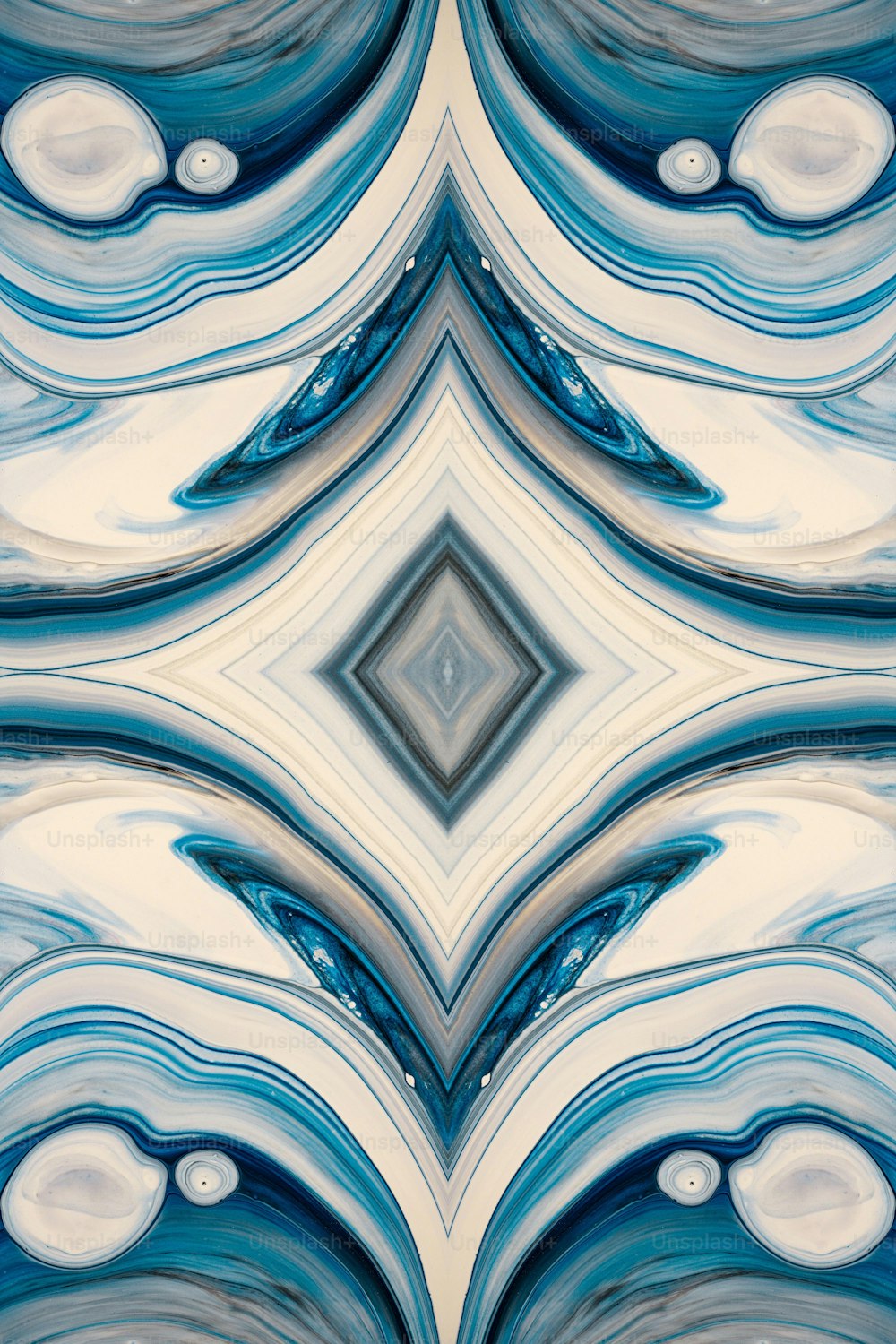 a blue and white abstract design with a diamond in the center