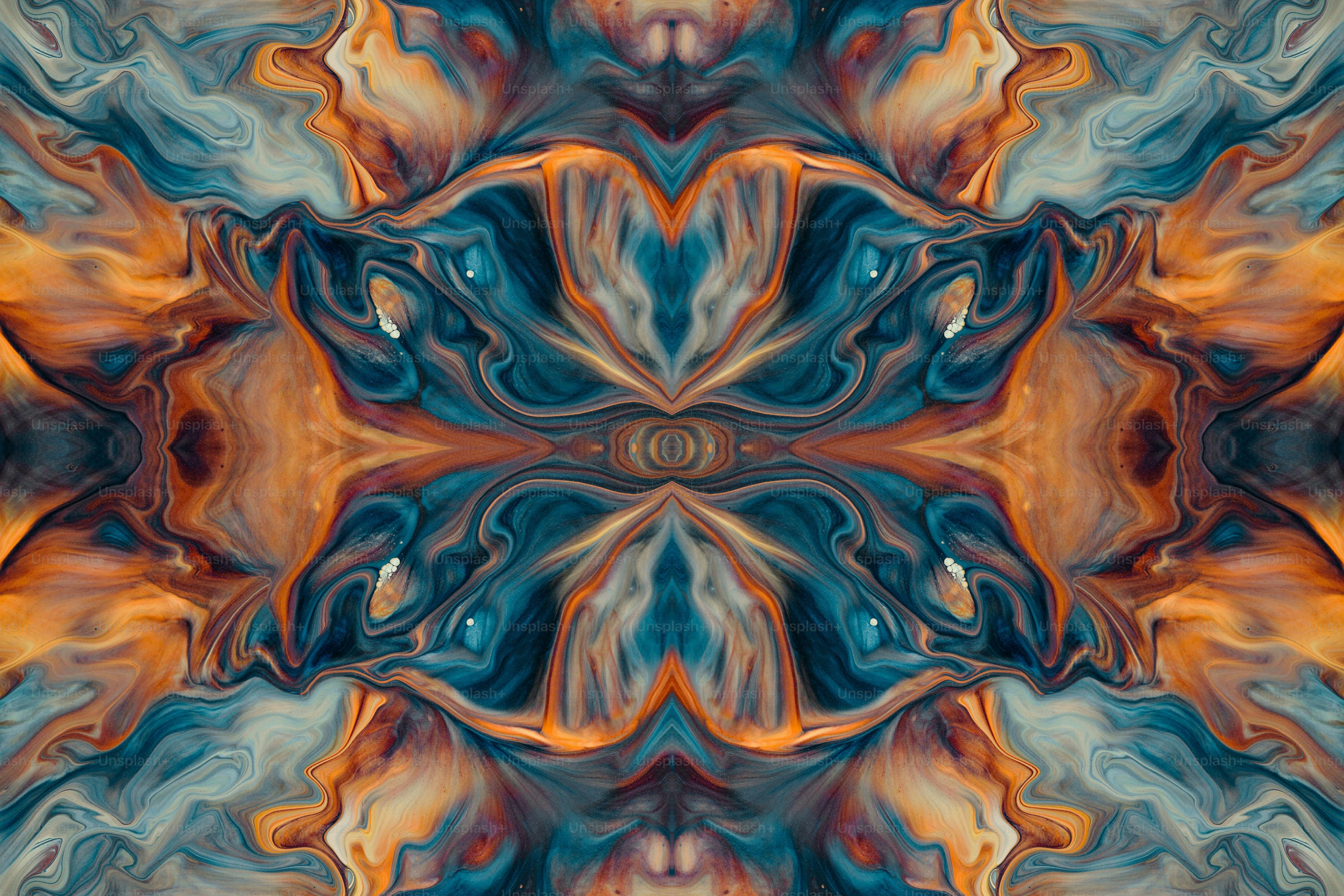 an abstract image of a blue, orange, and yellow flower