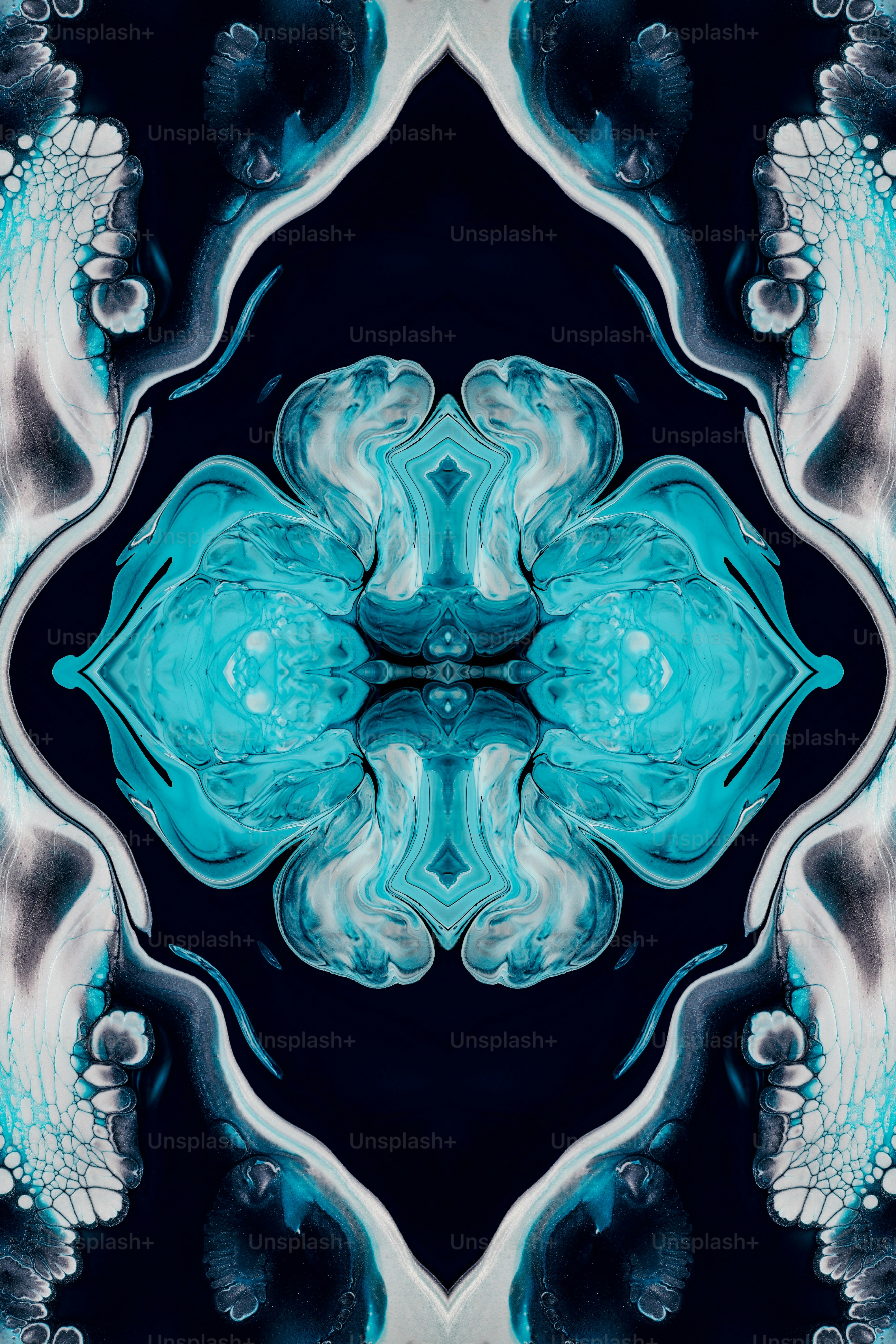 a blue and white flower with a black background