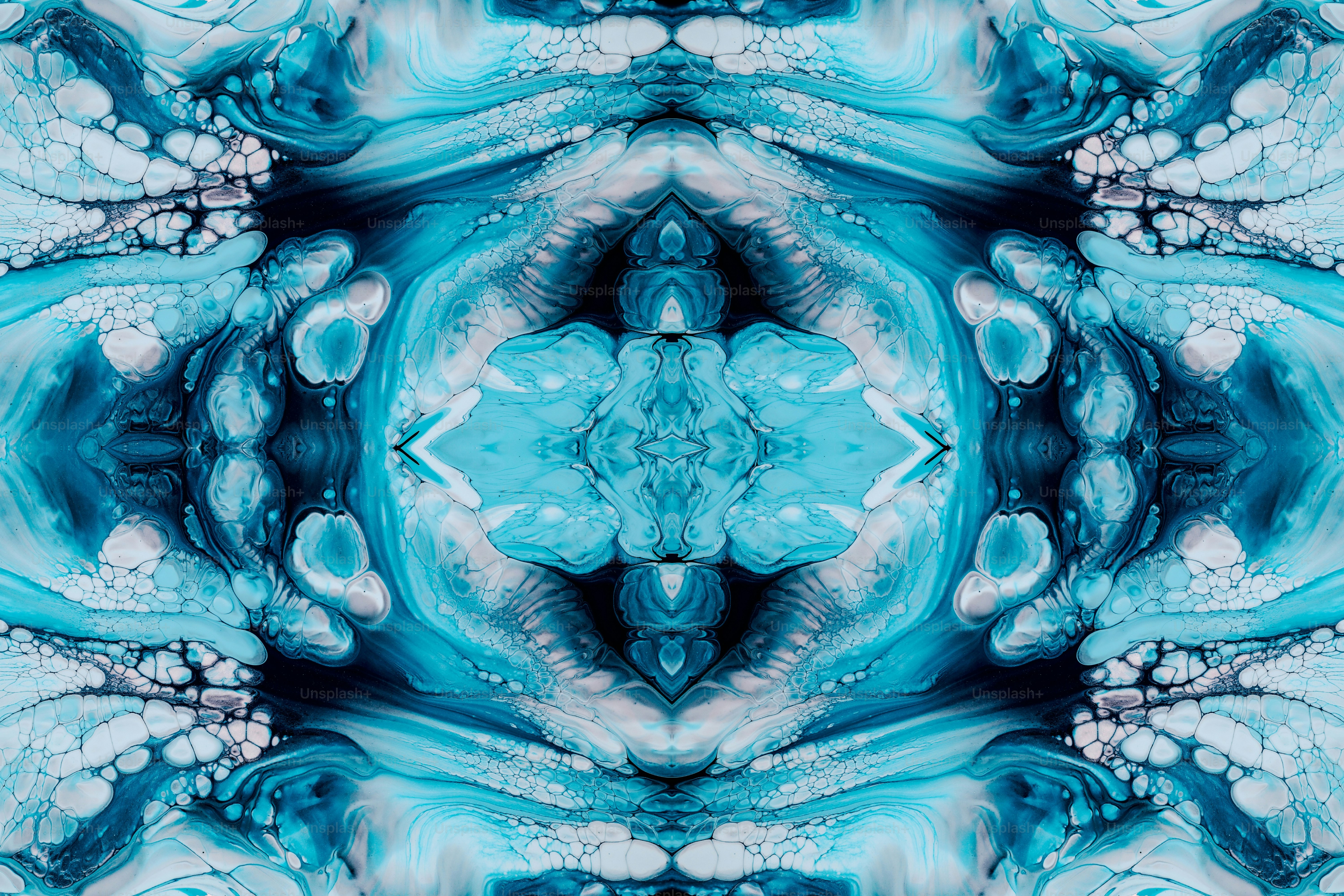 a blue and white abstract design with a large flower in the center