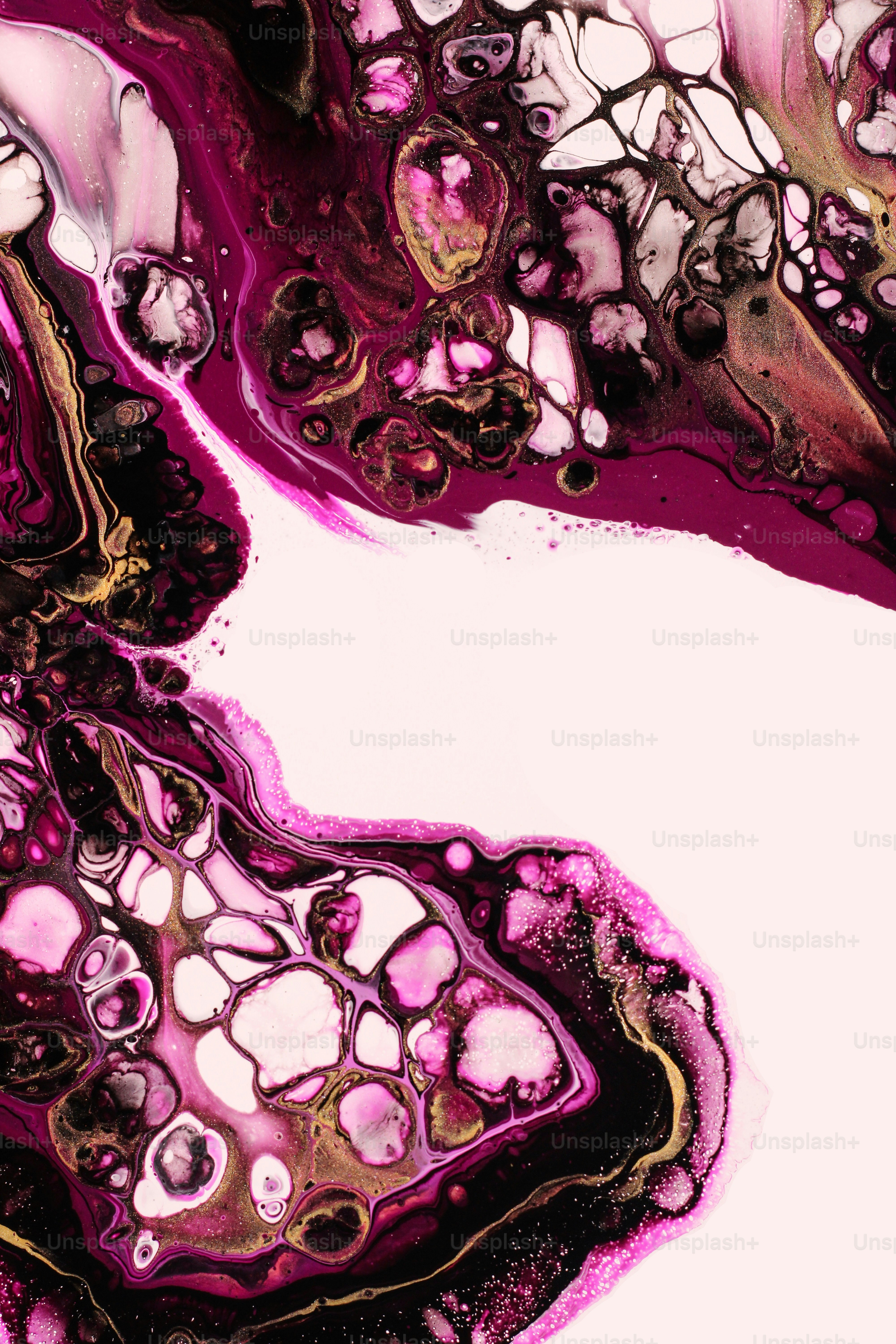 a close up of a pink and black substance