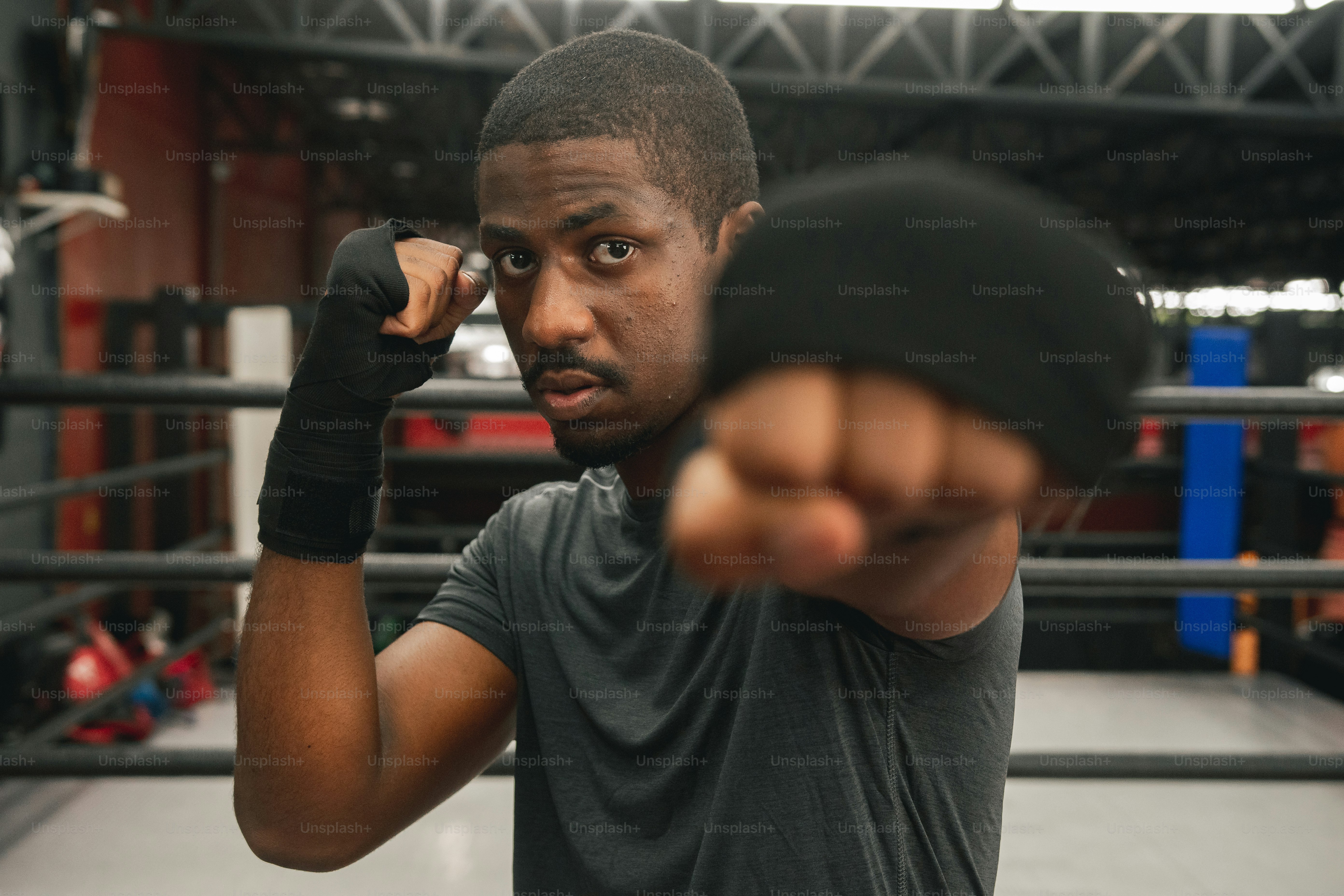 a man in a ring pointing a finger at the camera
