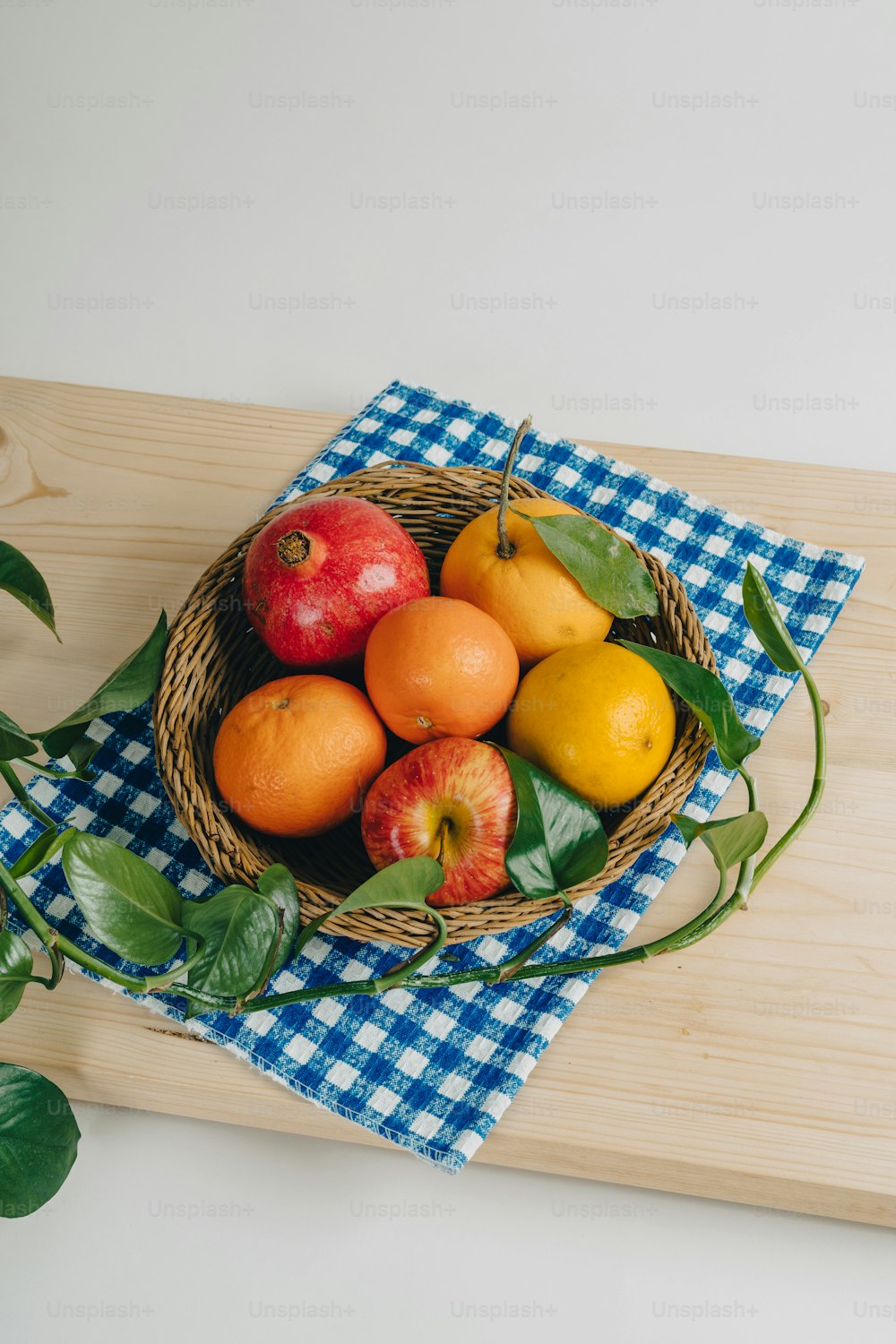 a basket of fruit sitting on top of a wooden table