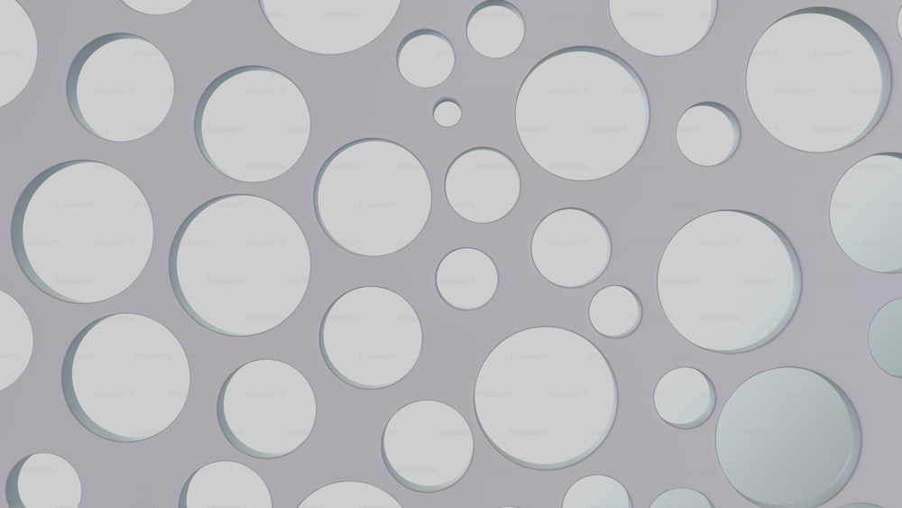 a gray and white wall with circles on it