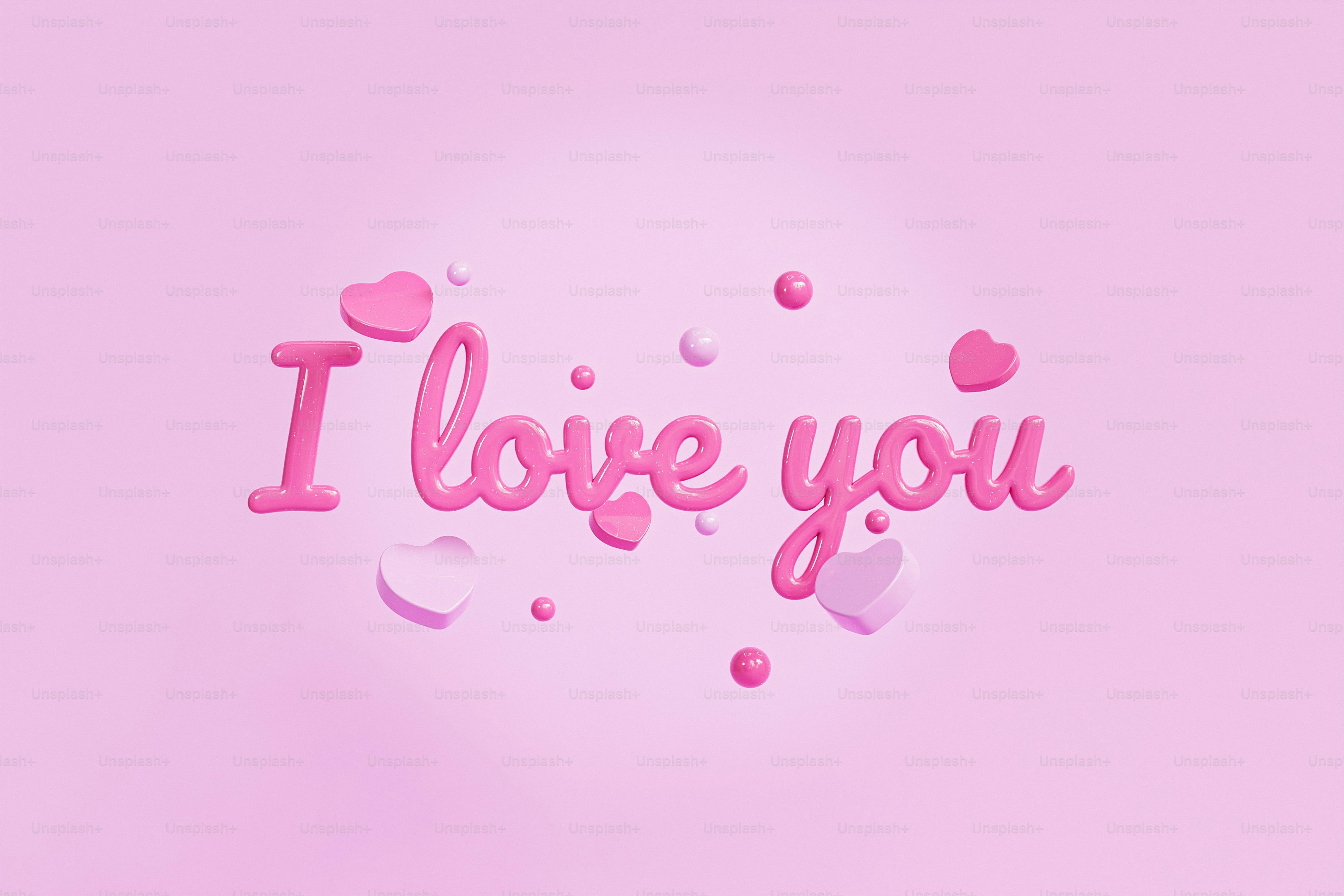 the word i love you is cut out of pink paper
