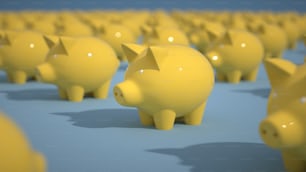 Eine Gruppe gelber Sparschweine sitzt in einer Reihe