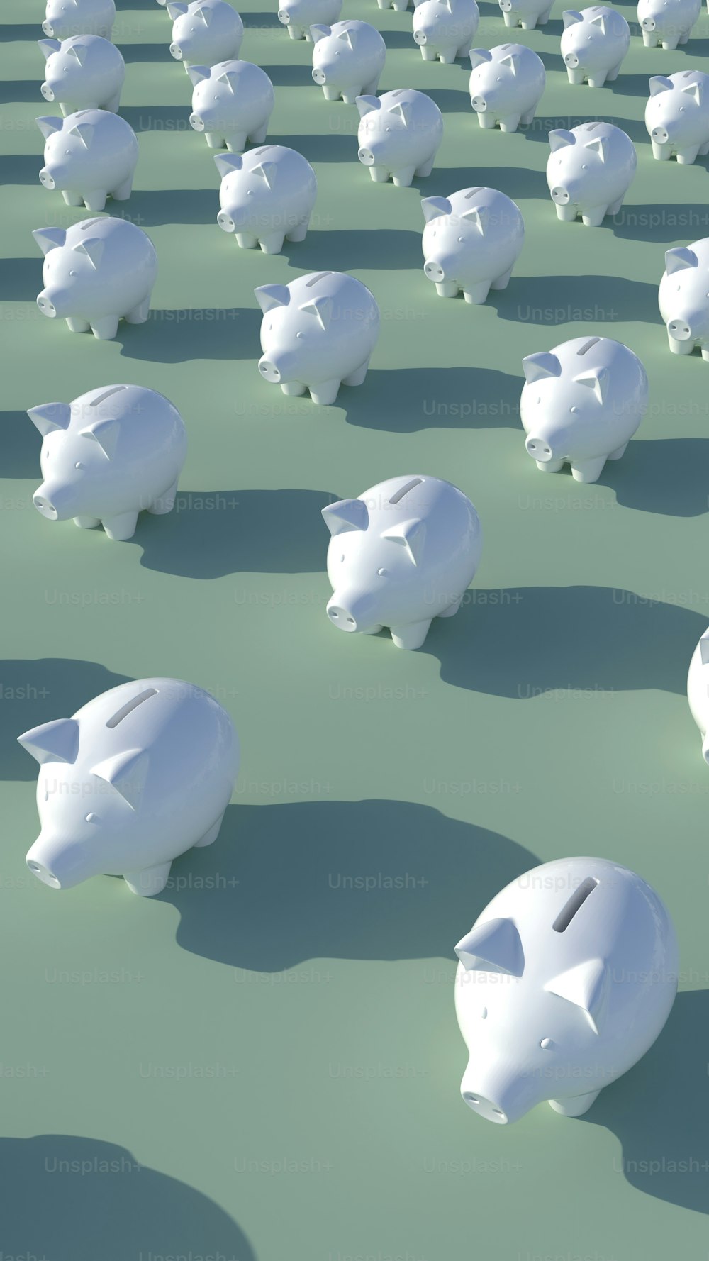 a group of piggy banks sitting on top of a green field