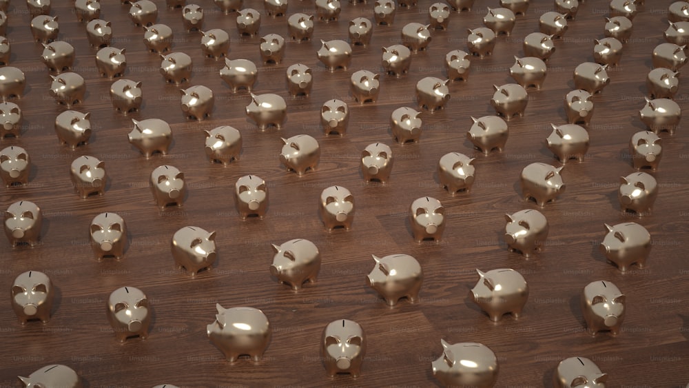 a large number of silver elephants on a wooden floor