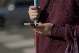 a woman holding a cell phone in her hands