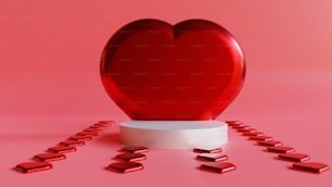 a red heart sitting on top of a white pedestal