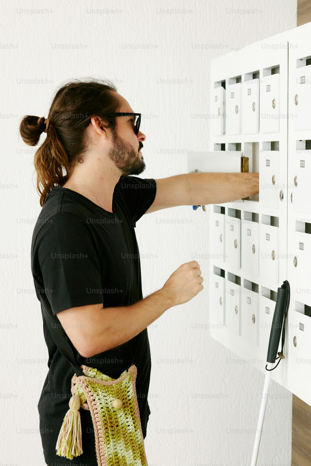 a man with a bag on a wall