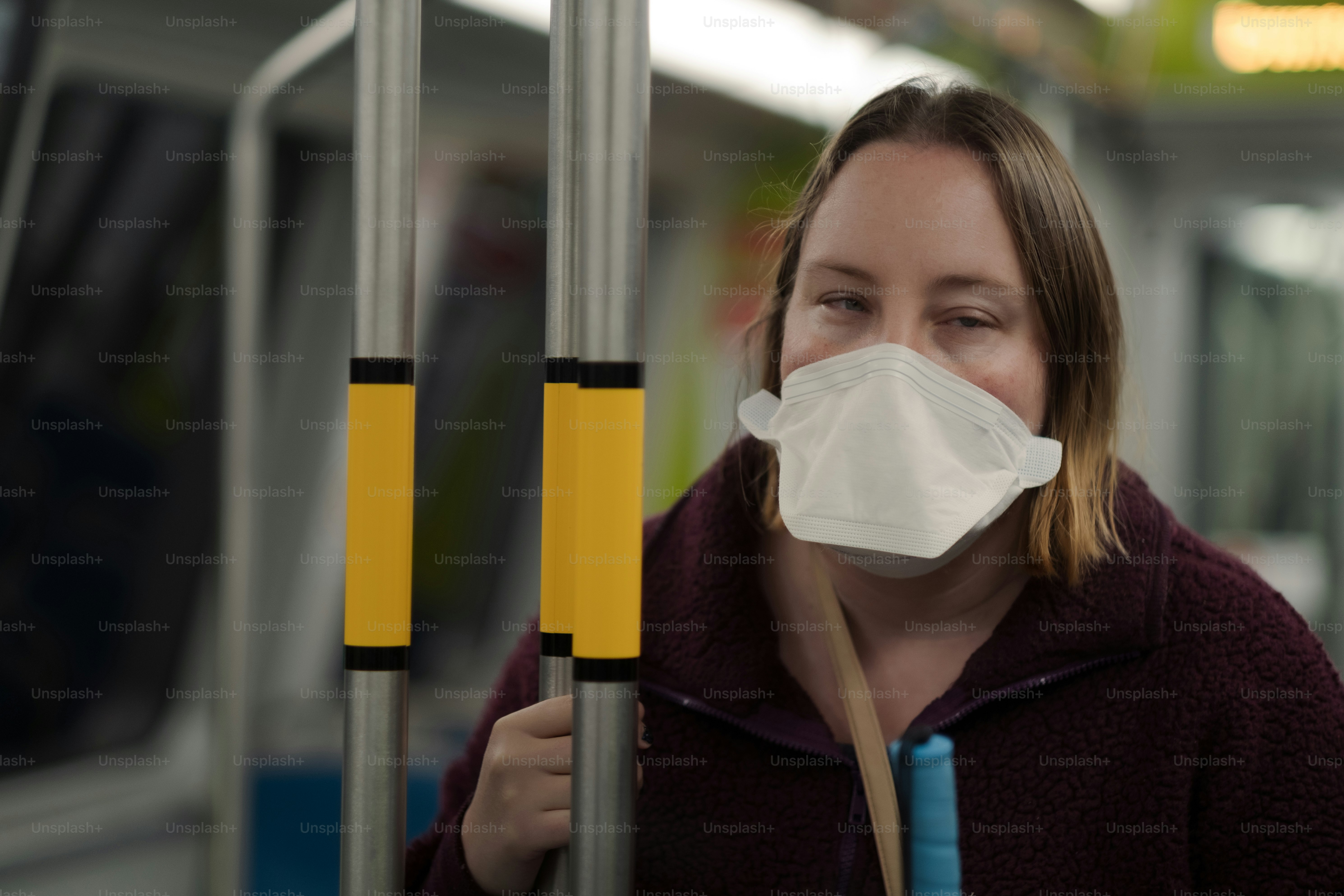 A woman wearing a face mask on a train photo – Usa Image on Unsplash