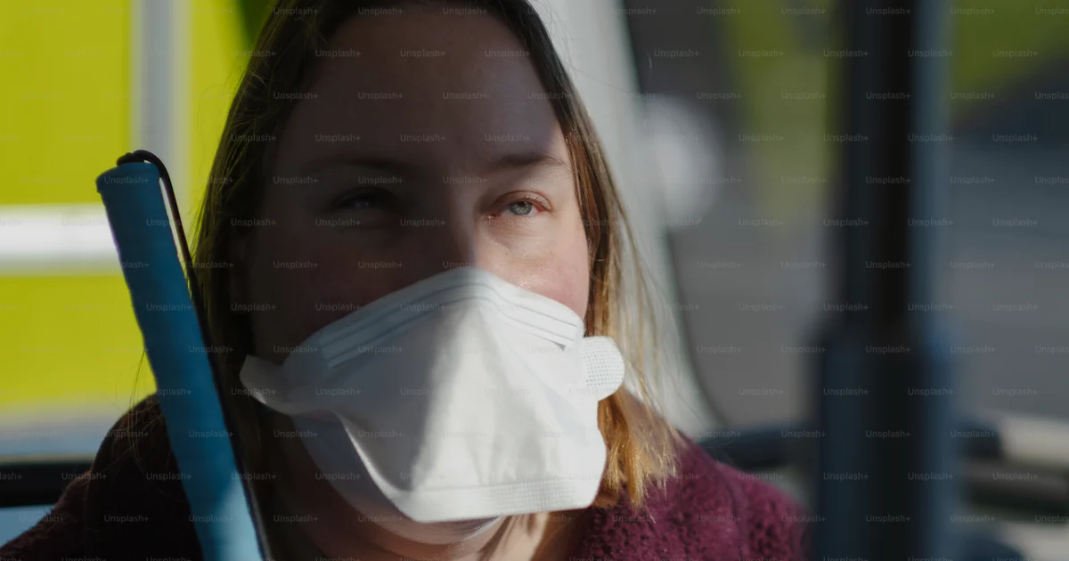 Face Mask Disability A woman wearing a face mask and holding a stick photo – Disability ...