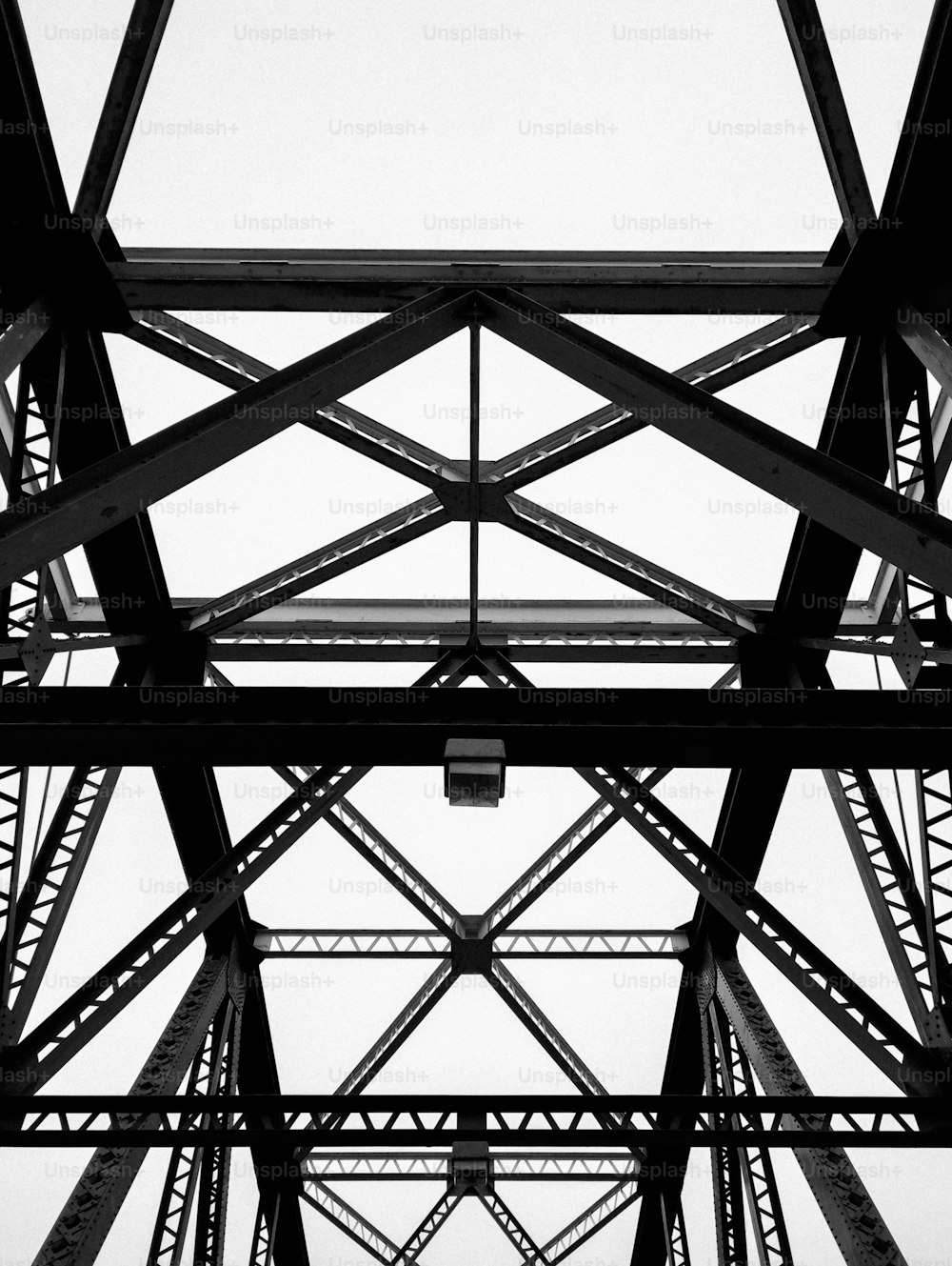 a black and white photo of a metal structure