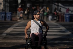 a man in a wheel chair on the street