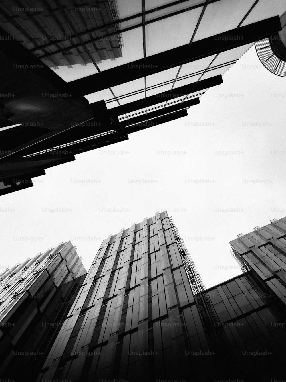 a black and white photo of tall buildings