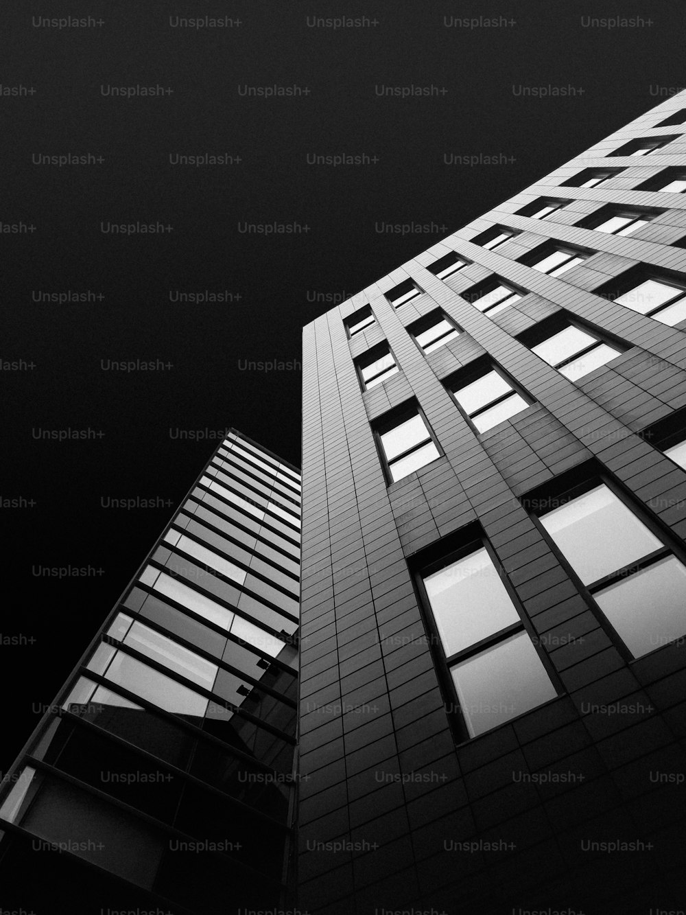 a black and white photo of a tall building