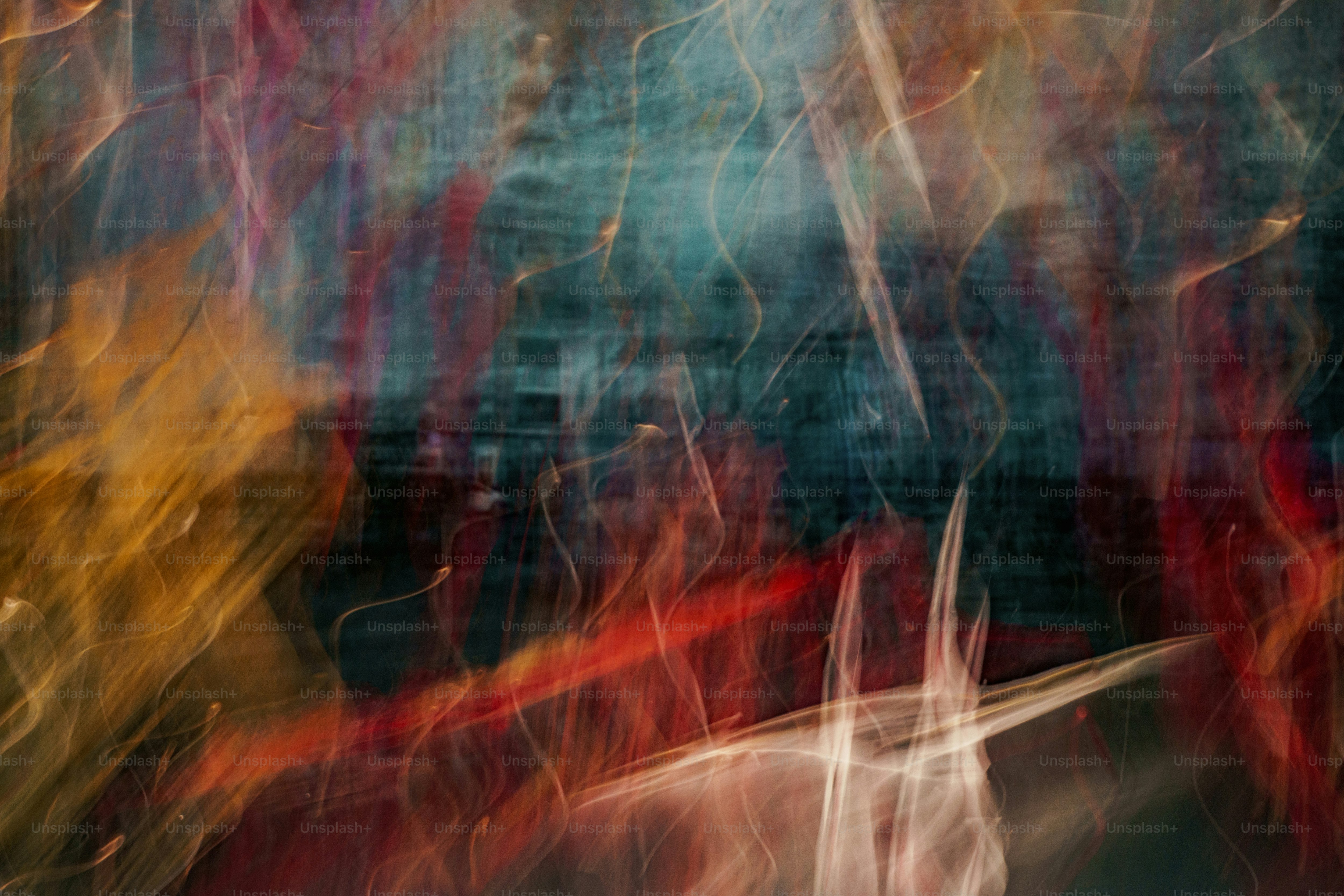 a blurry photograph of a red and yellow bench