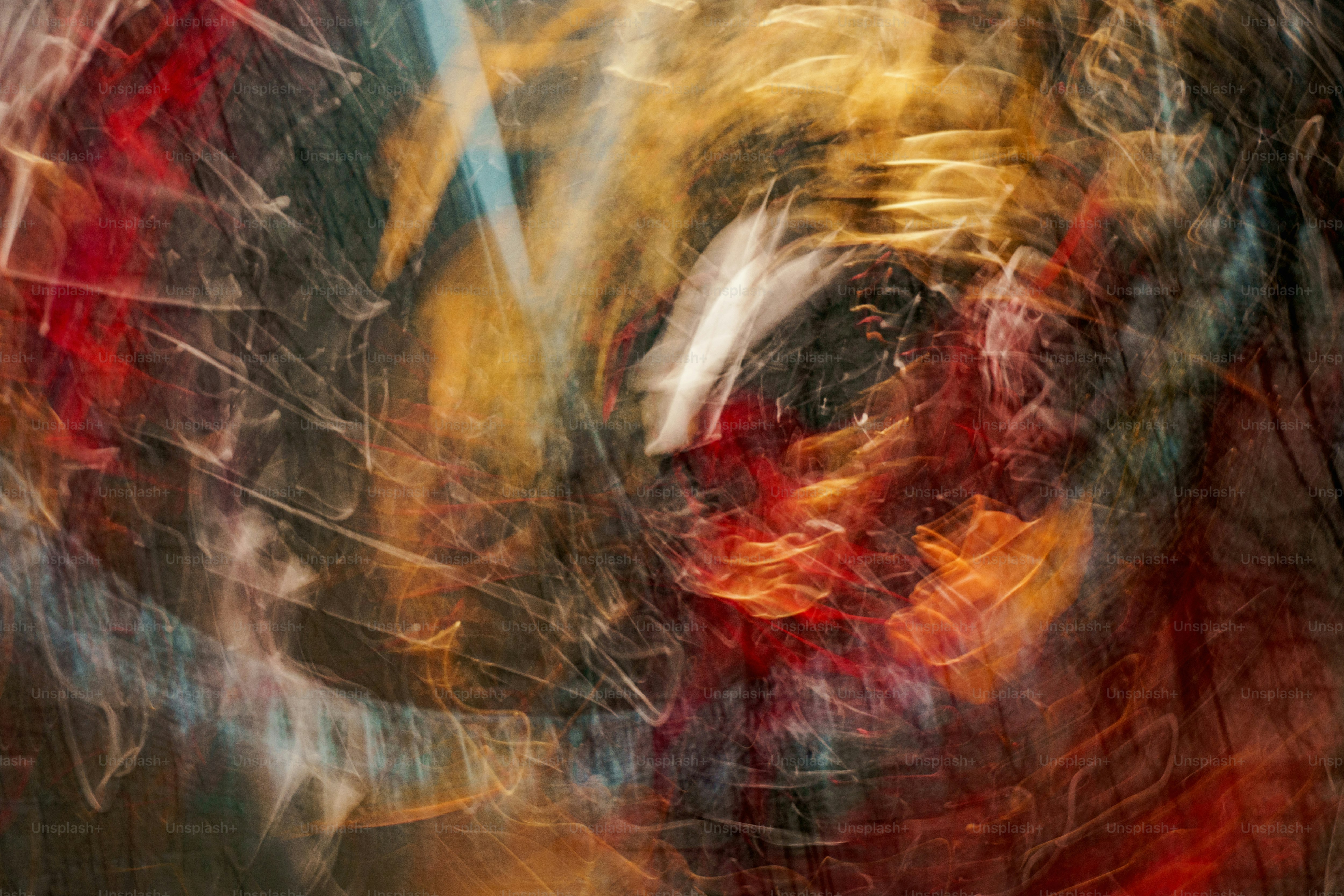 a blurry photograph of a red and yellow object