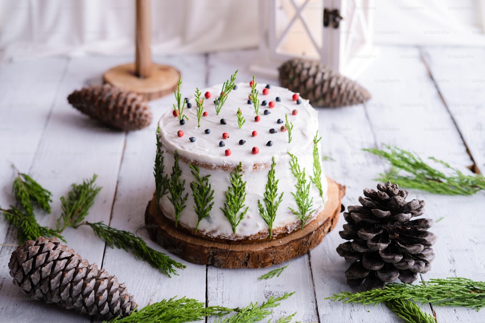 a decorated cake sitting on top of a wooden table