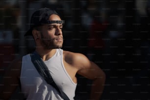 a man with a baseball cap and glasses on