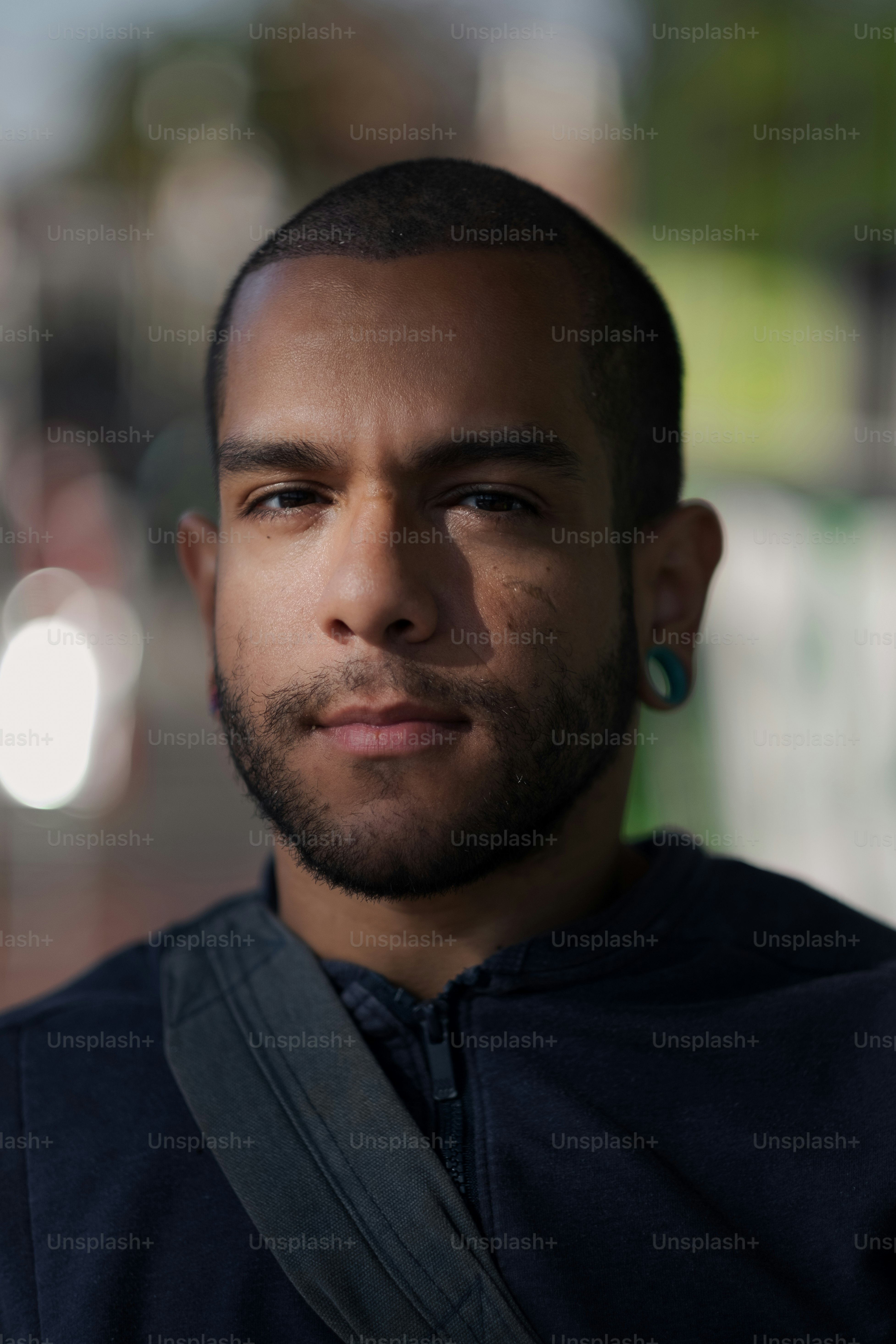 a close up of a person wearing a black shirt