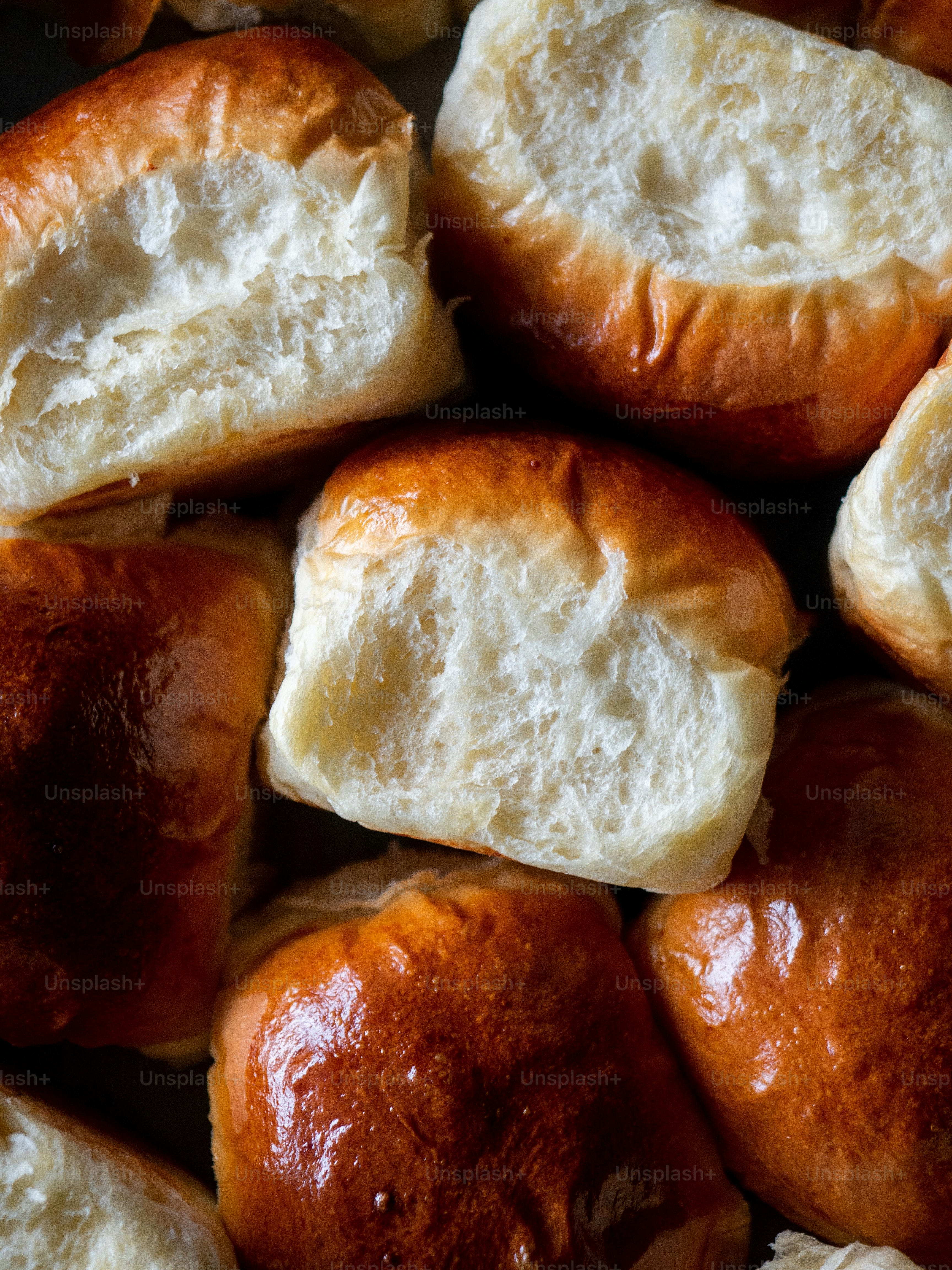 a pile of bread rolls sitting on top of a table