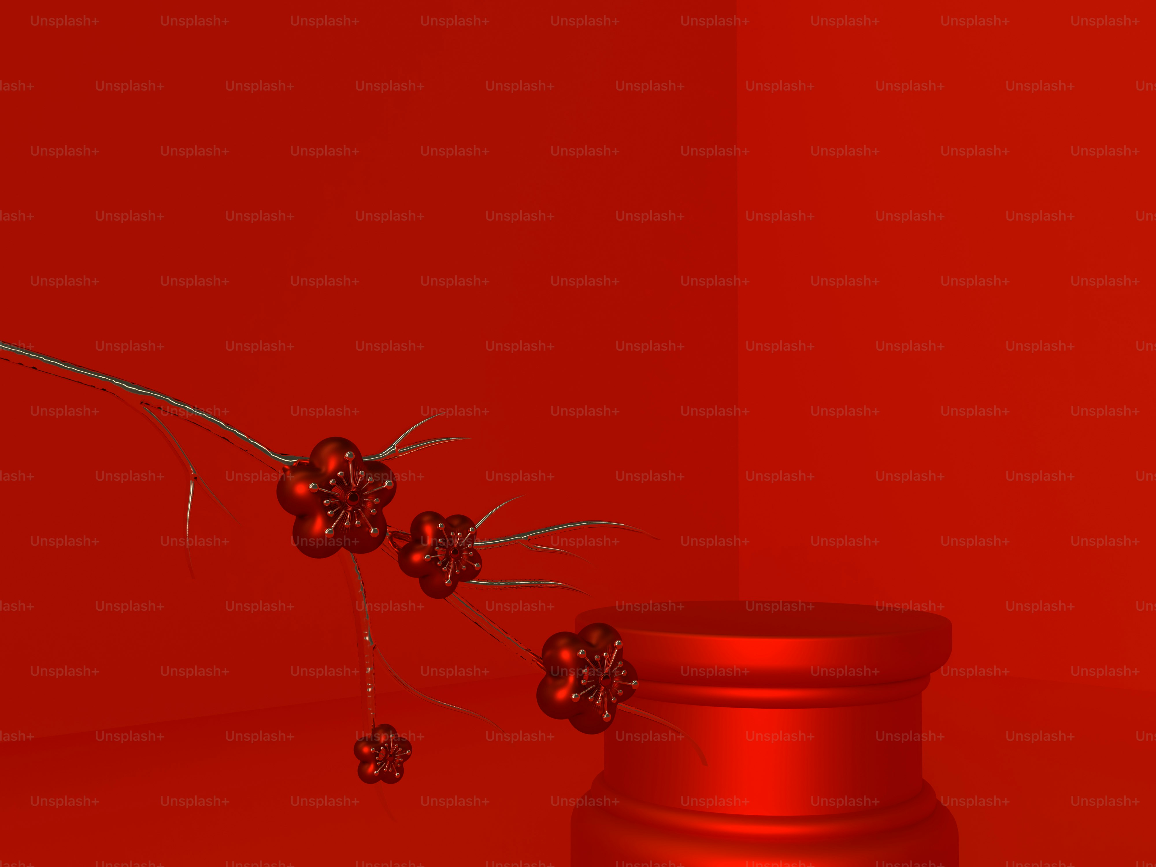 a red vase with some berries on it