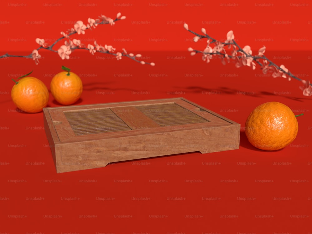 three oranges sitting on top of a wooden box