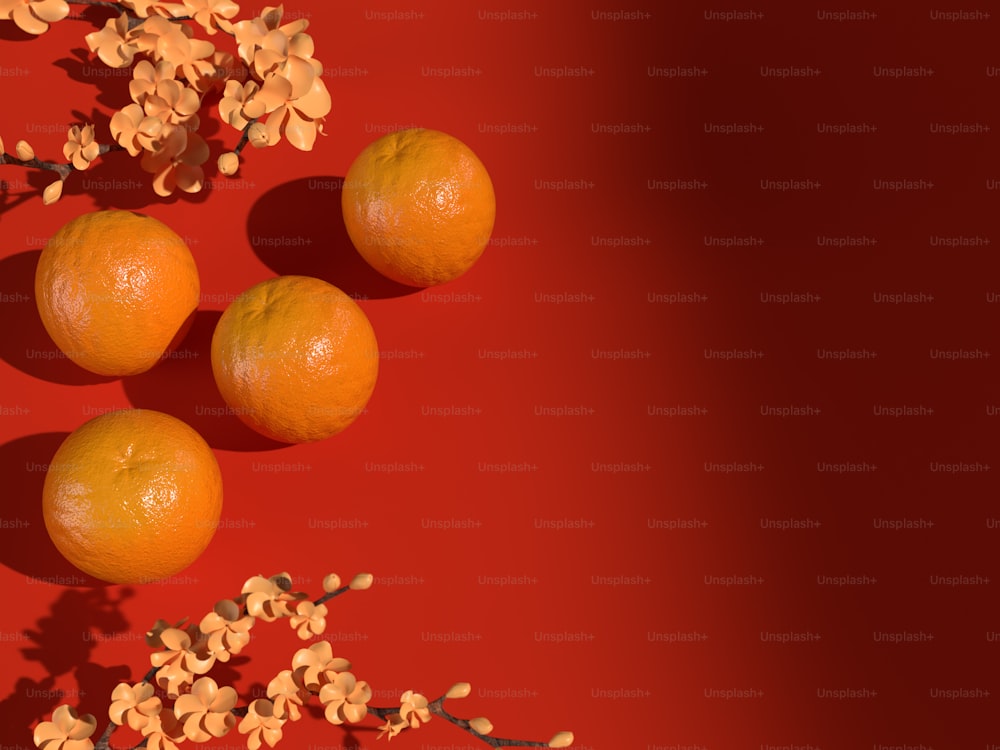 Un grupo de naranjas sentadas encima de una superficie roja