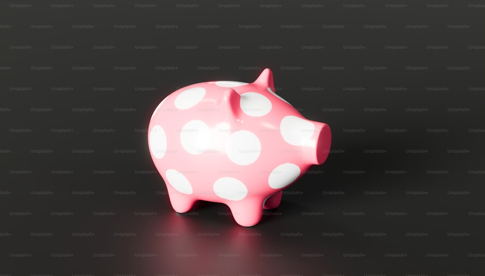 a pink piggy bank with white polka dots