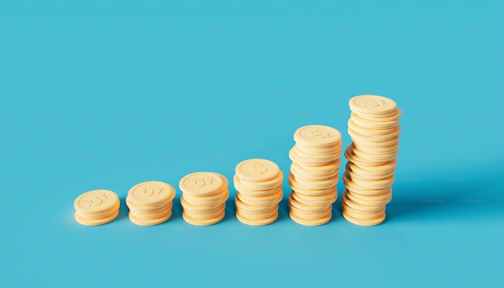 a stack of coins sitting on top of a blue surface