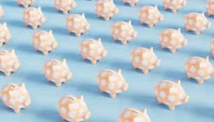 Eine Gruppe von Polka-Dot-Sparschweinen sitzt auf einer blauen Oberfläche