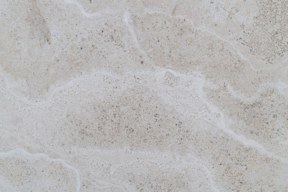 a close up of a white marble surface