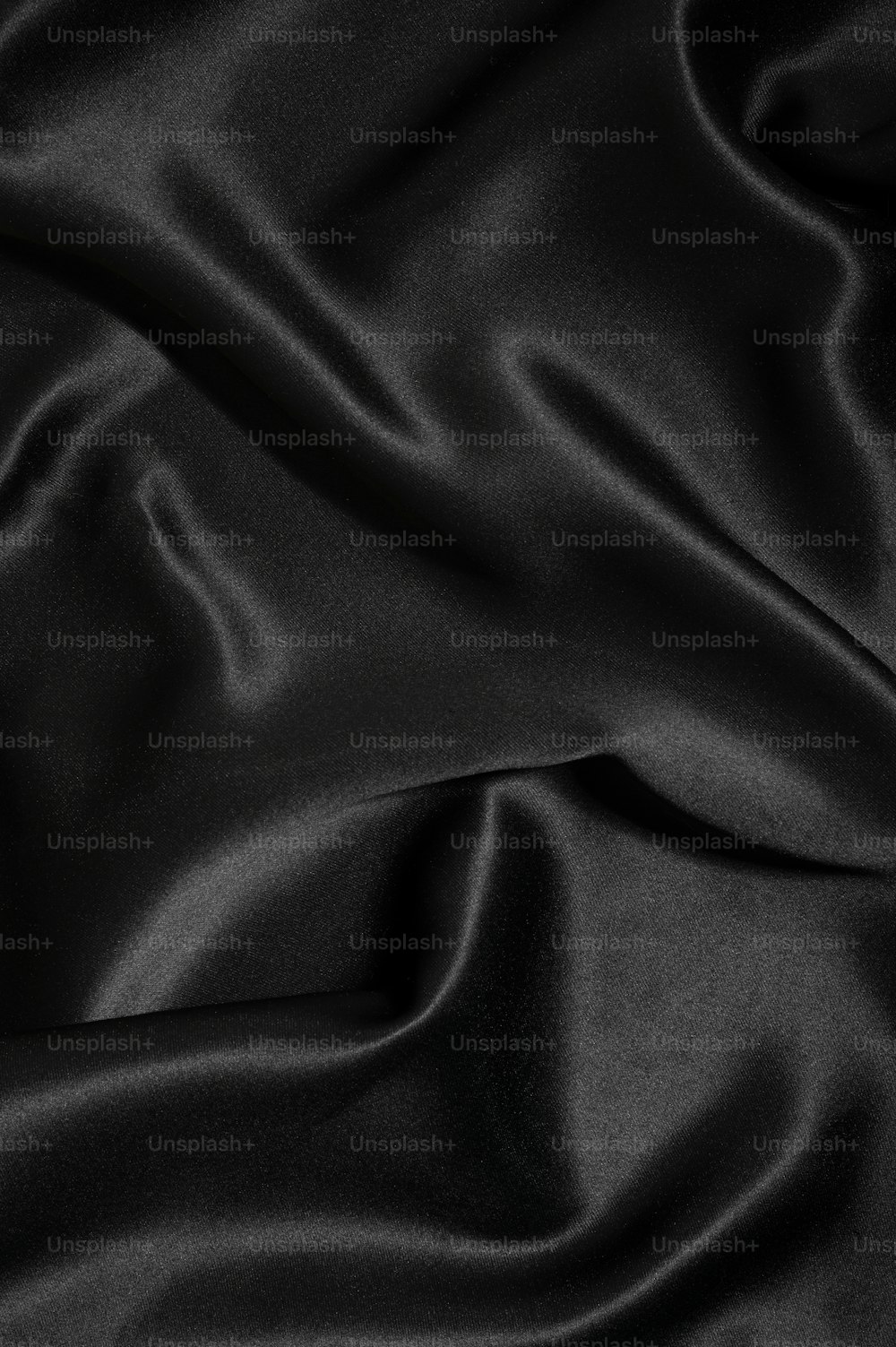 a close up of a black satin fabric