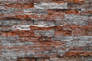 a close up of a brick wall made of red bricks