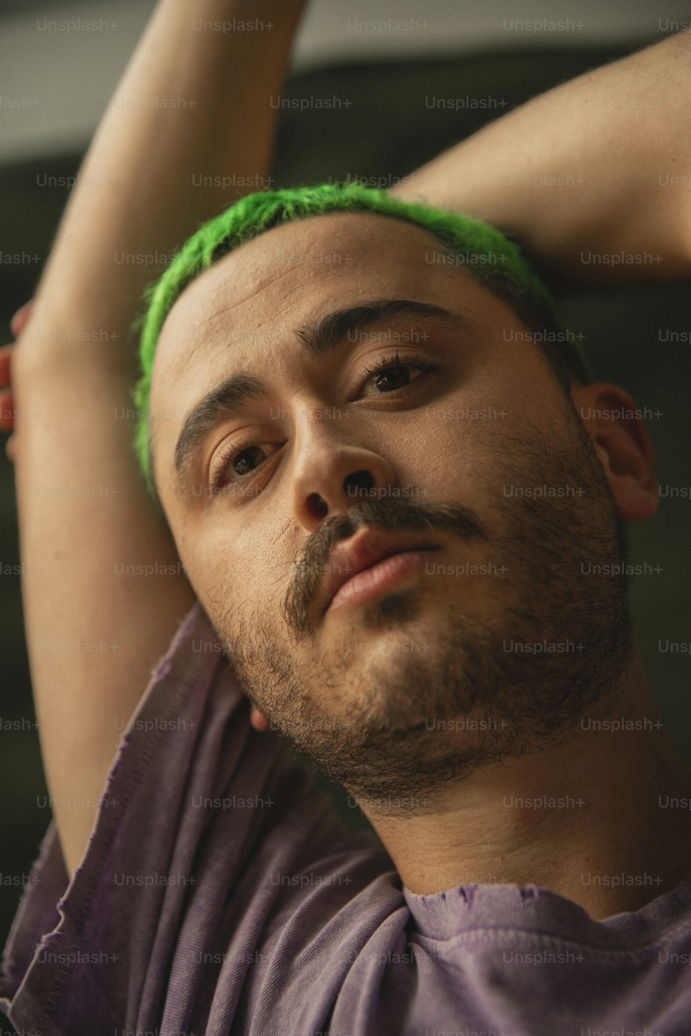 a man with green hair and a beard