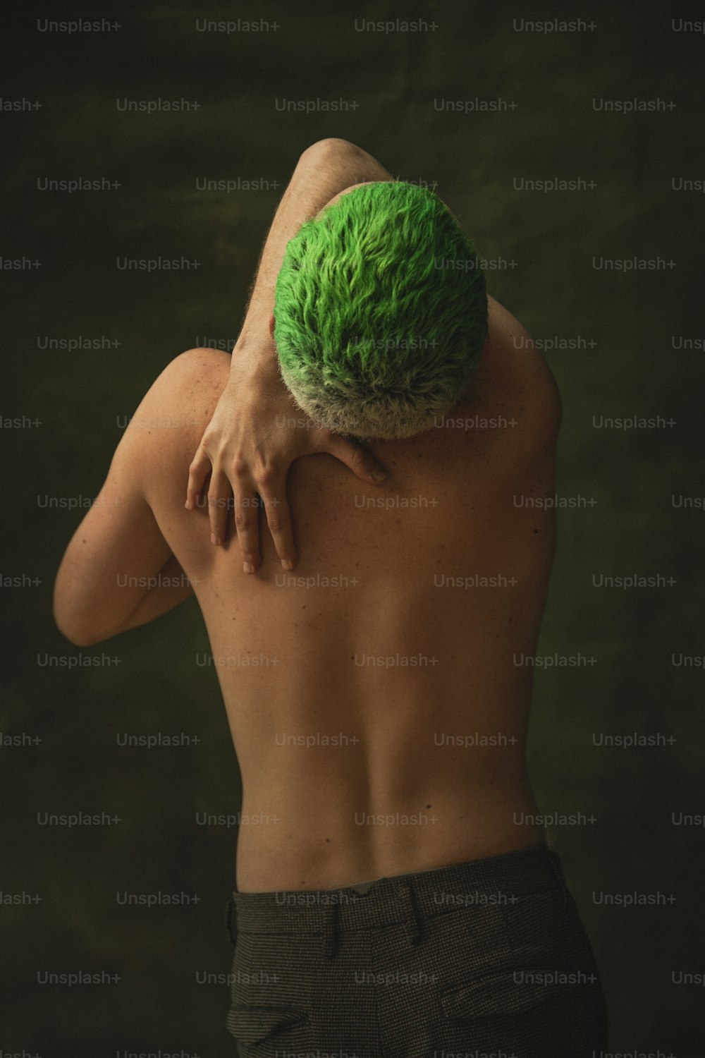 a man with a green ball on his back