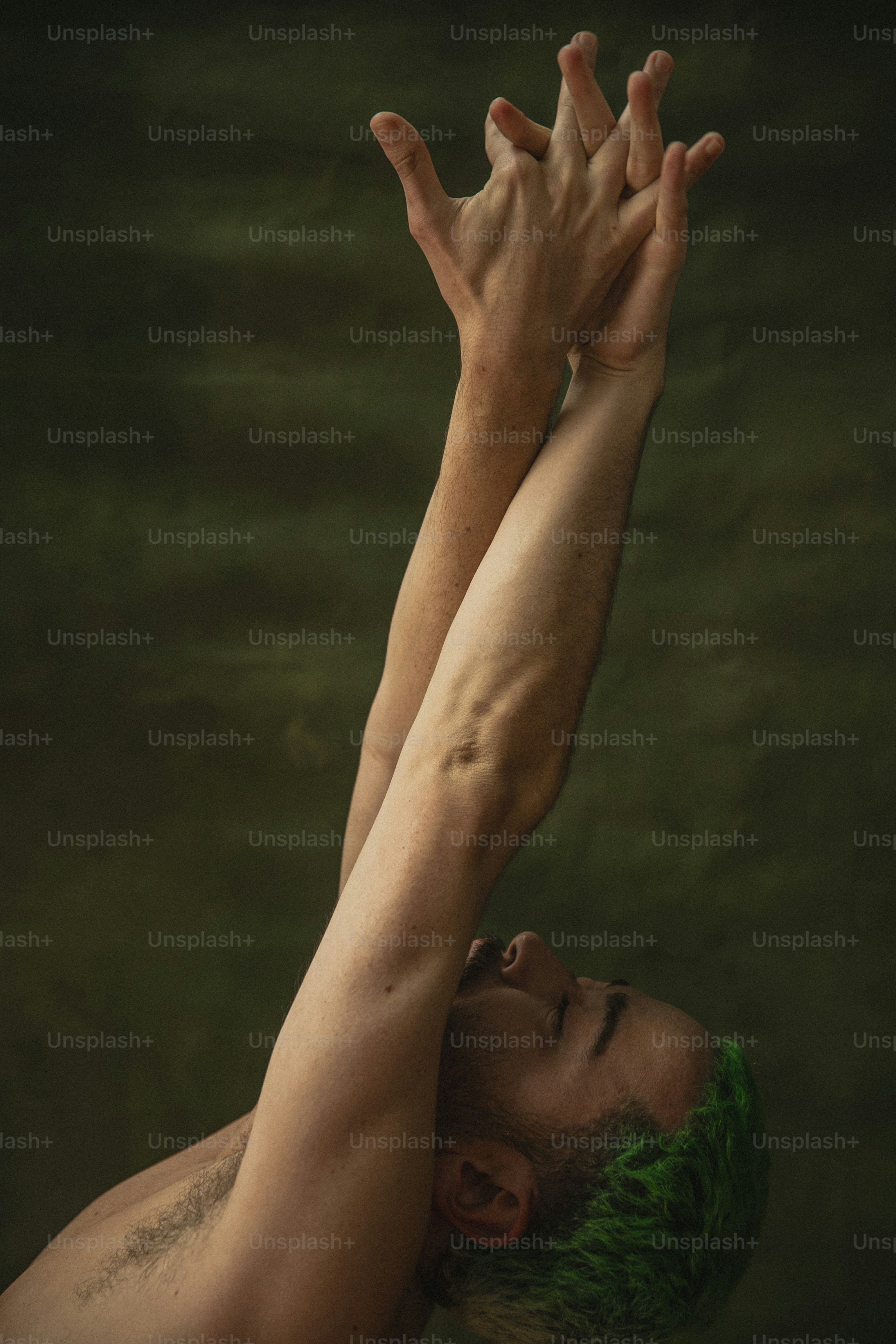 a man with his hands up in the air