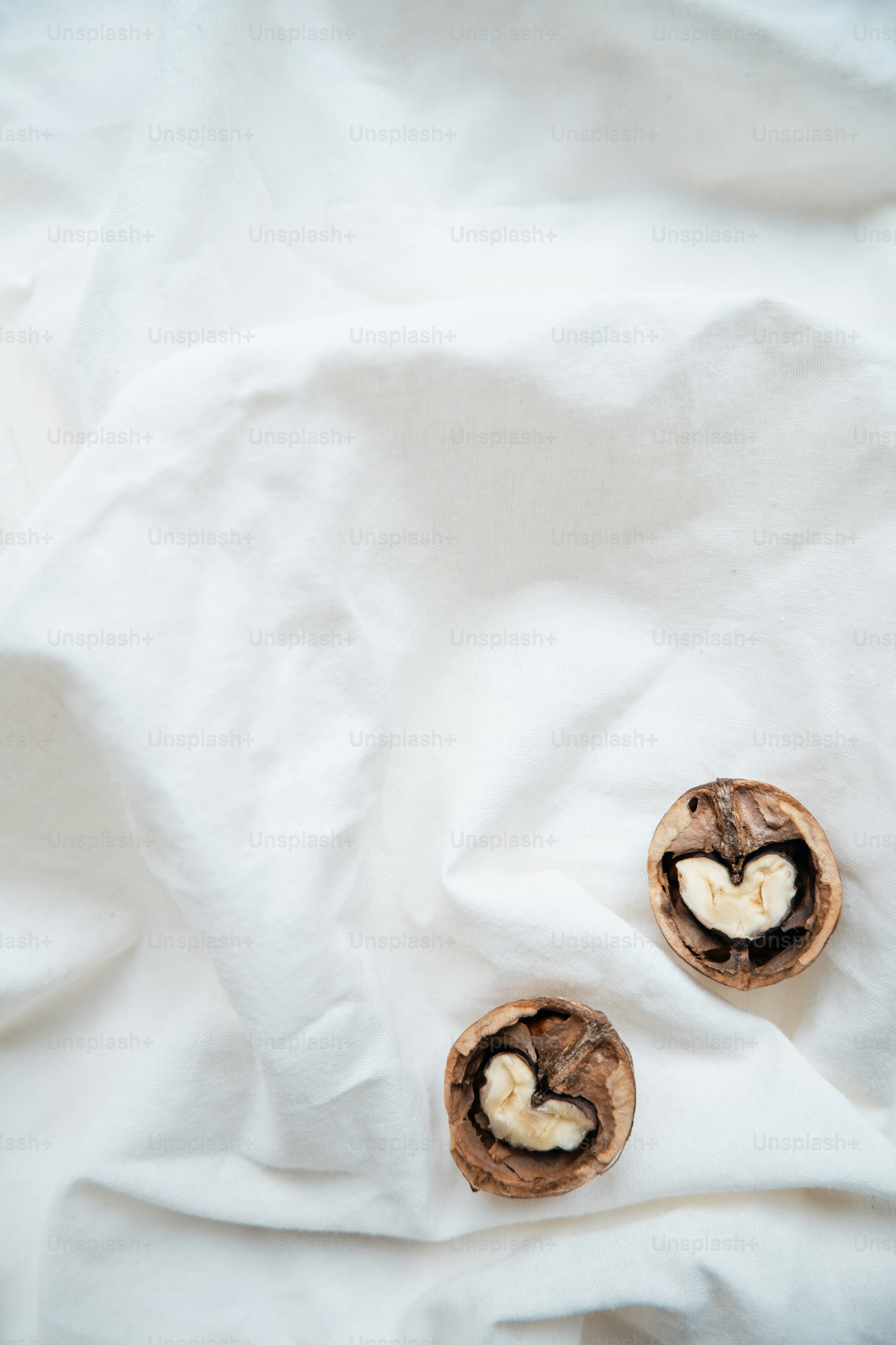 a couple of bananas sitting on top of a white cloth