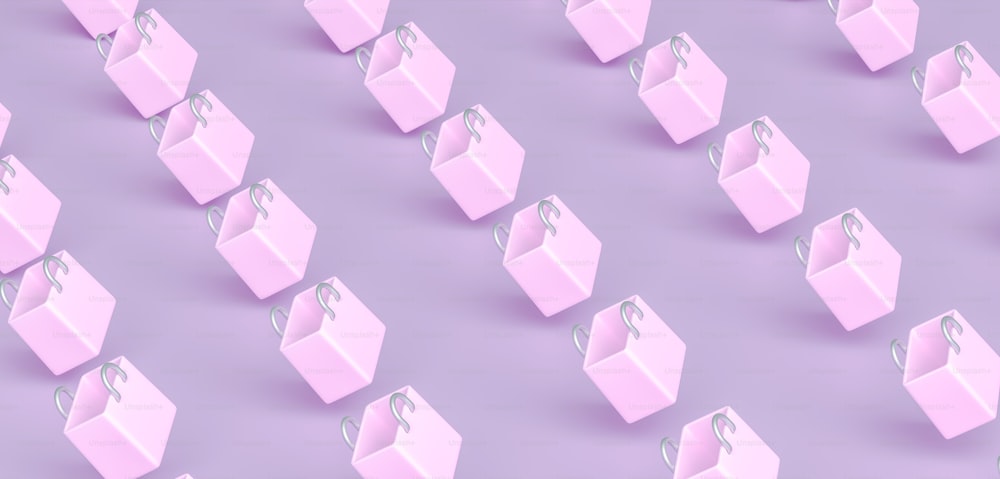 a group of pink shopping bags on a purple background