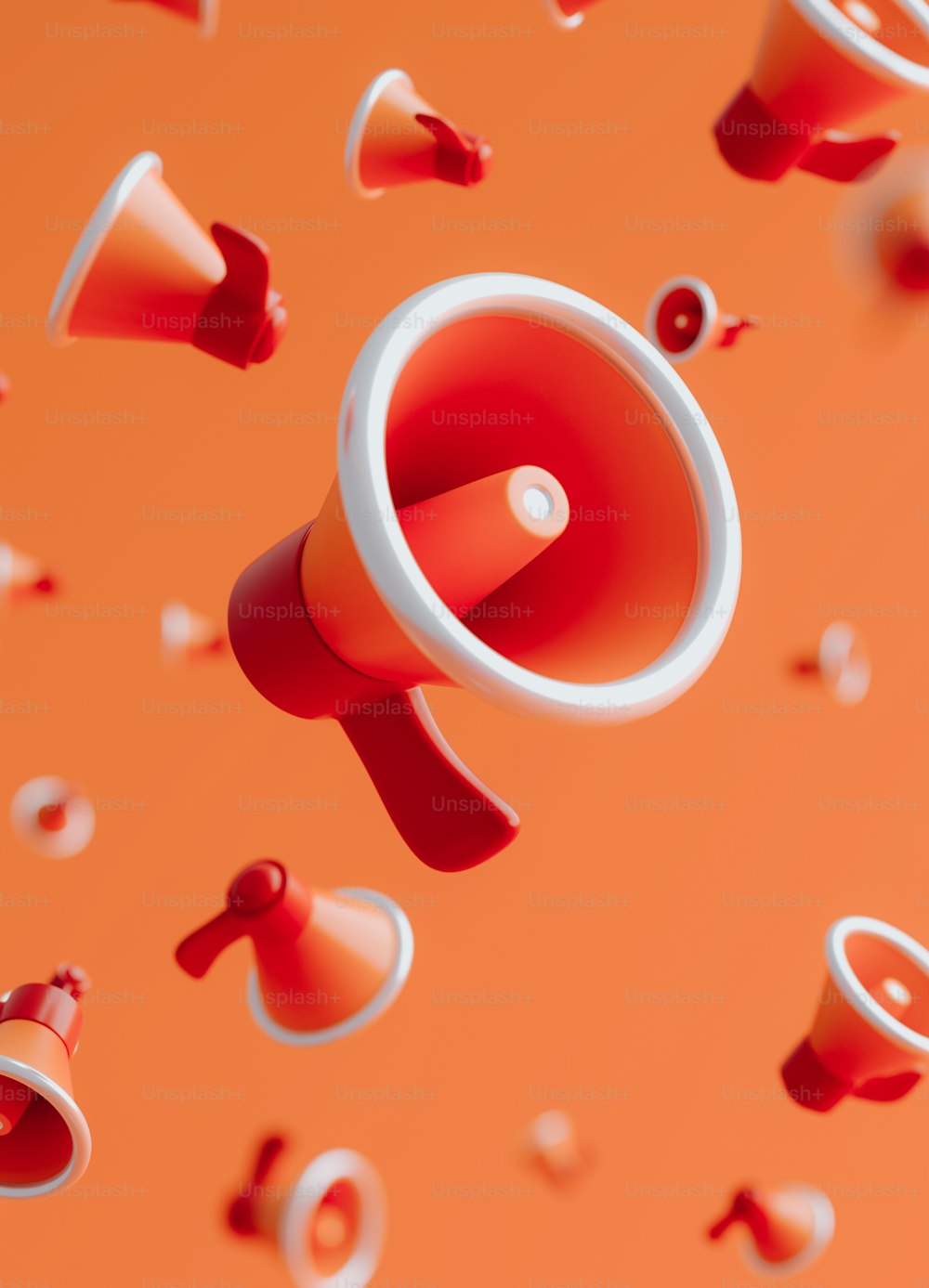 a red and white megaphone surrounded by red and white confetti