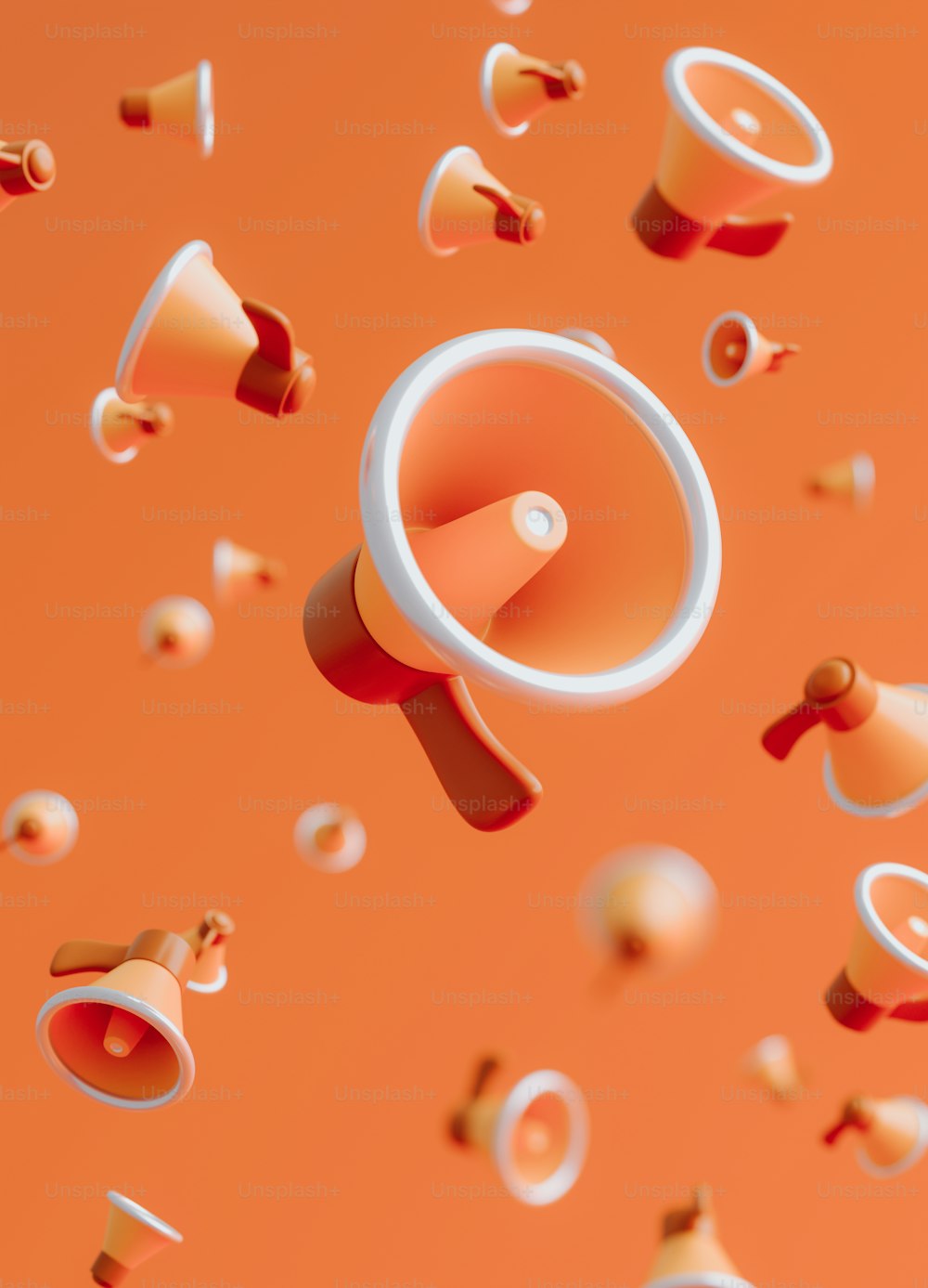 un fondo naranja con un altavoz rodeado de confeti