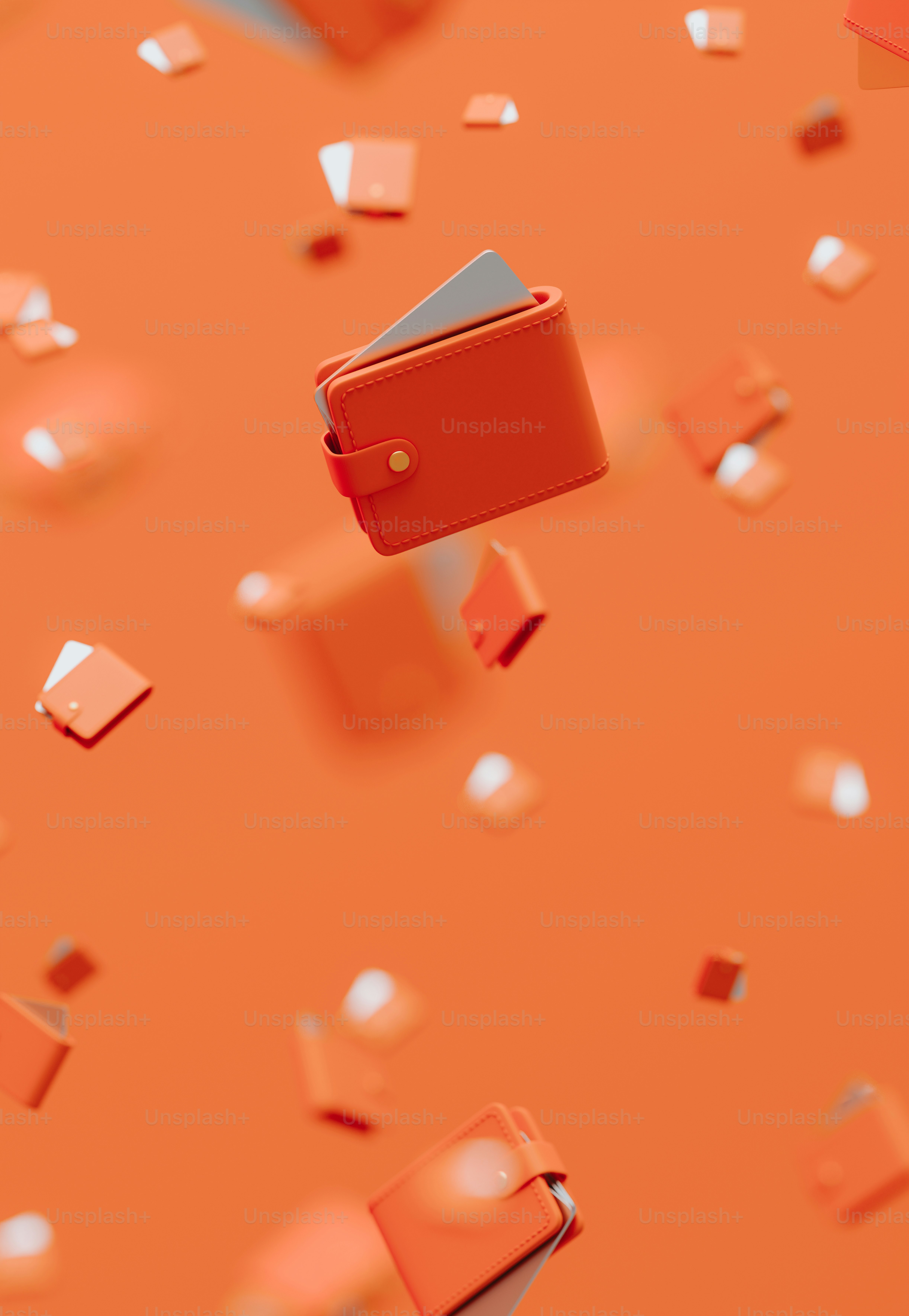 A red wallet flying through the air on an orange background photo