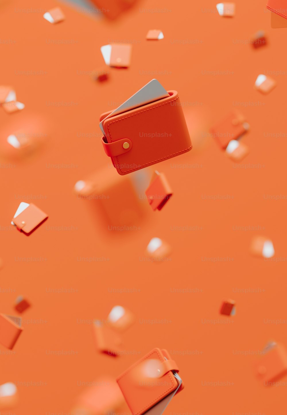 Una billetera roja volando por el aire sobre un fondo naranja