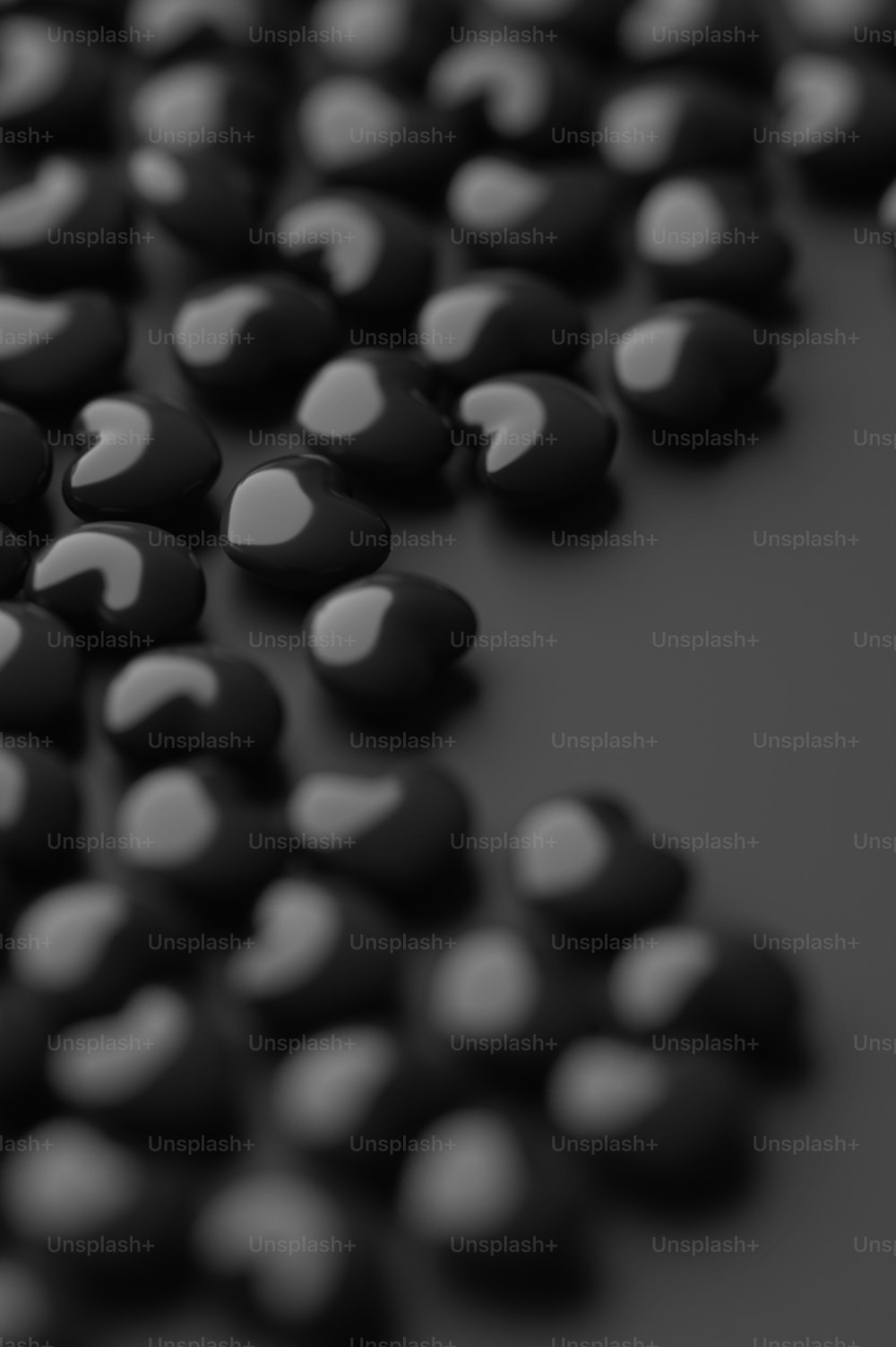 a group of black and white candies on a table